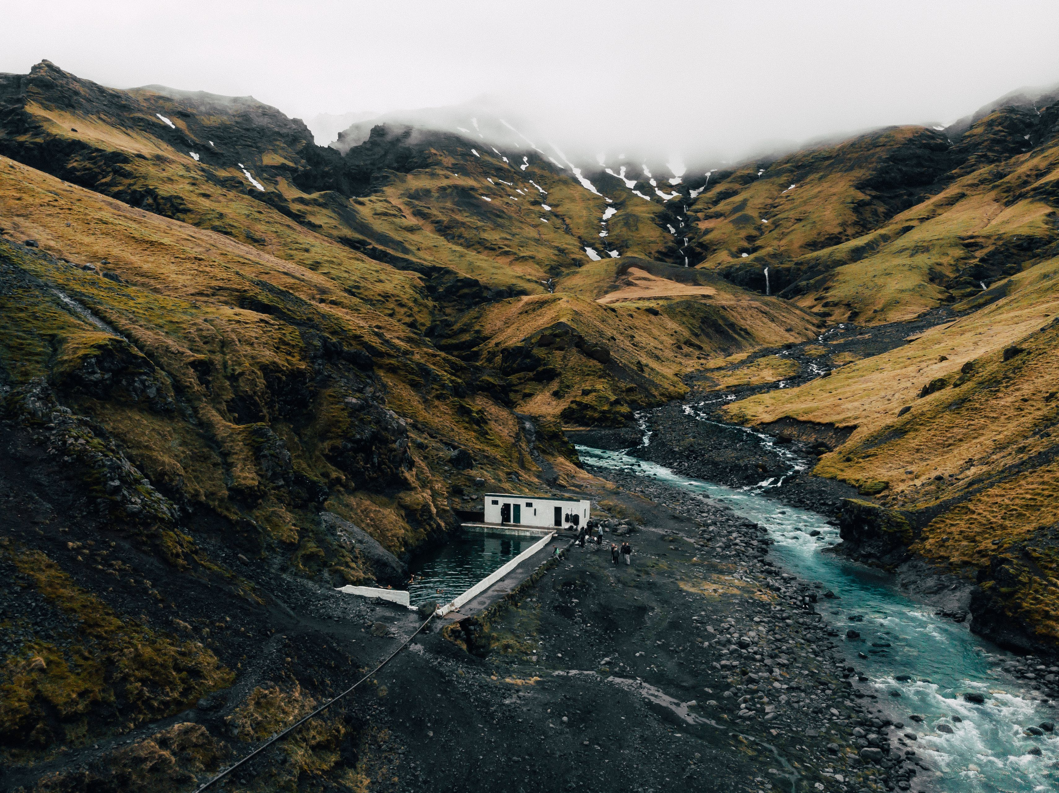 Fall in Iceland's mountains, natural hot spring pool