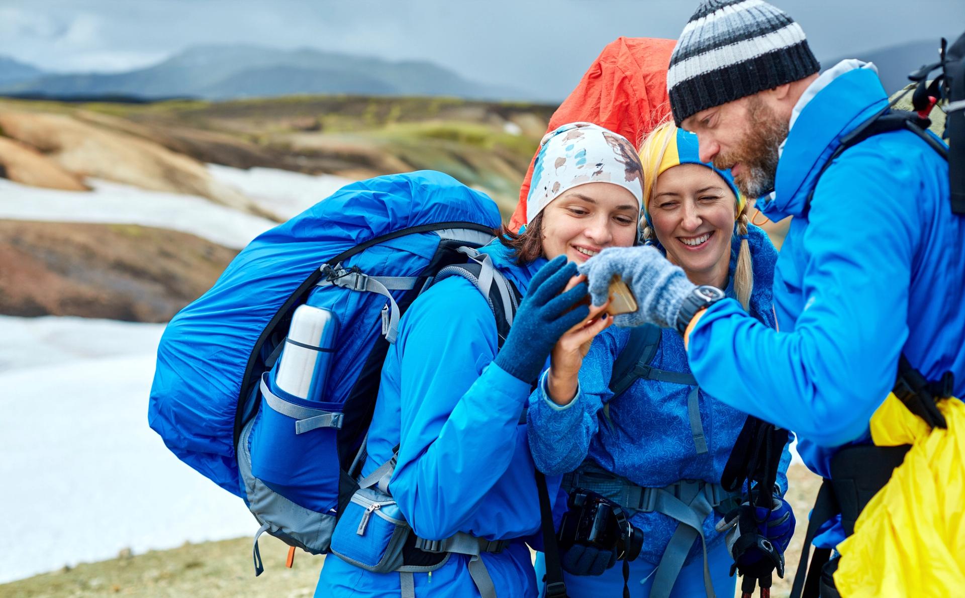 couple friends hikers in the icelandic mountains.