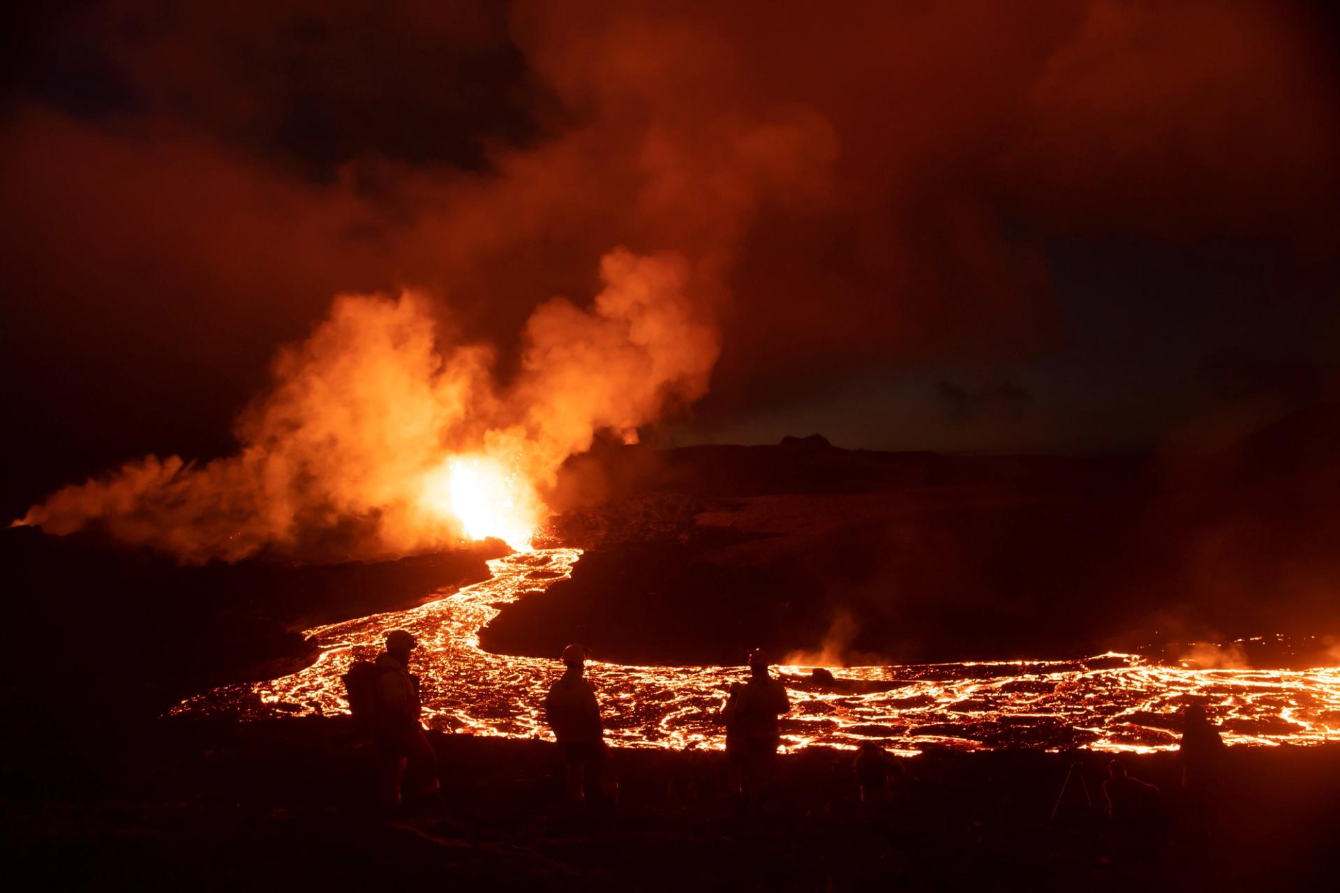 Volcanic eruption landscape at night spectators, Iceland