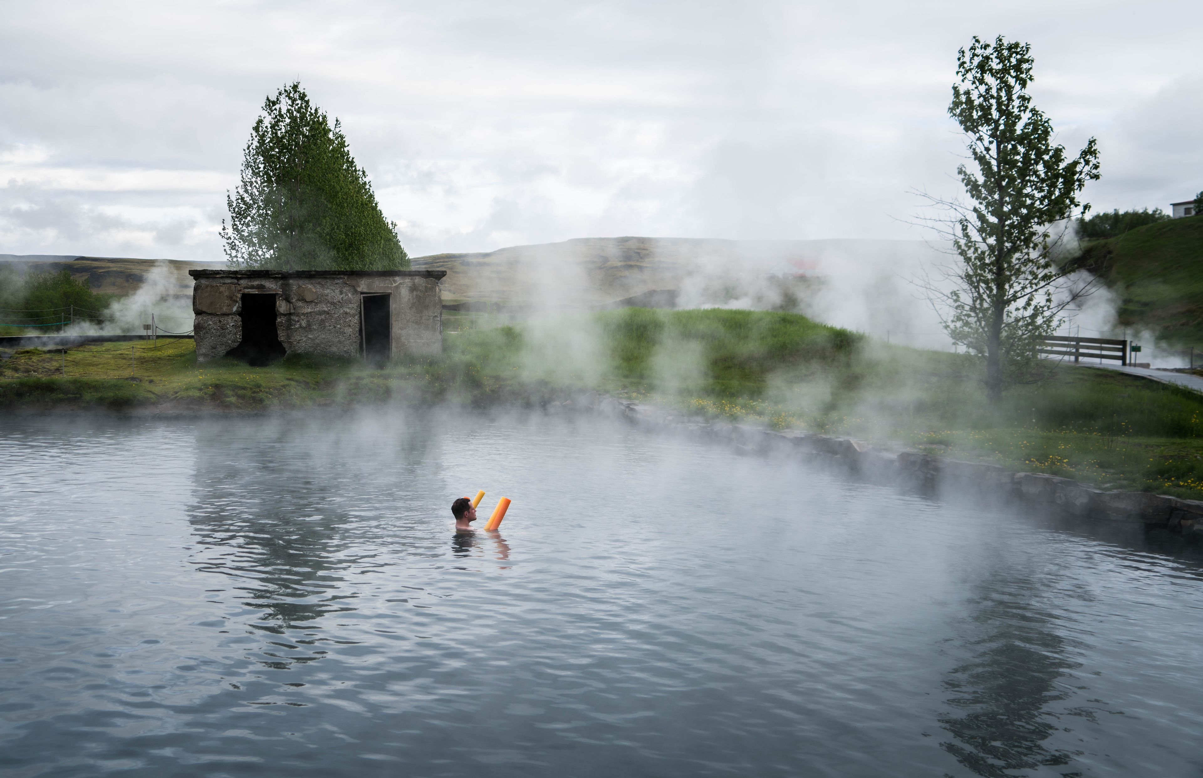 Hot springs in iceland: Secret lagoon, a hot spring  swimming pools located near the golden circle in Iceland