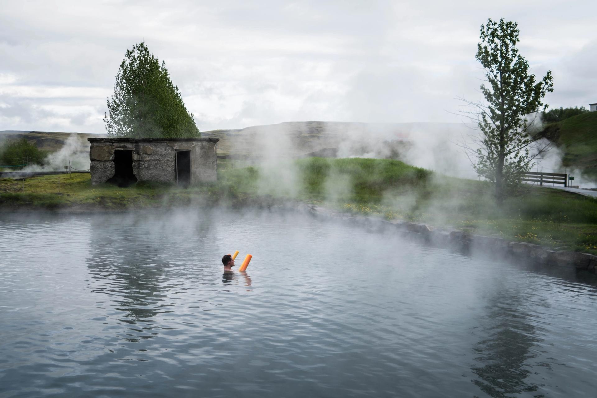Hot springs in iceland: Secret lagoon, a hot spring  swimming pools located near the golden circle in Iceland