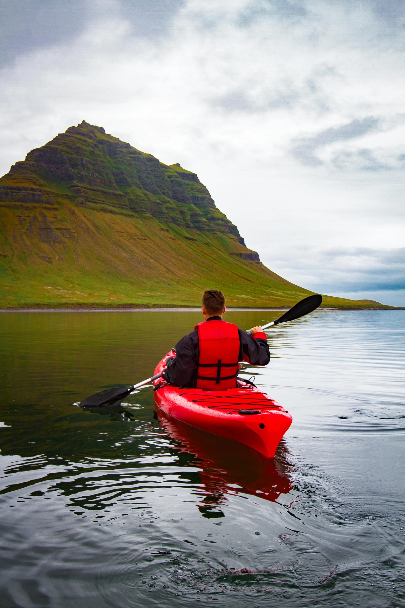 A man kayaking in Iceland