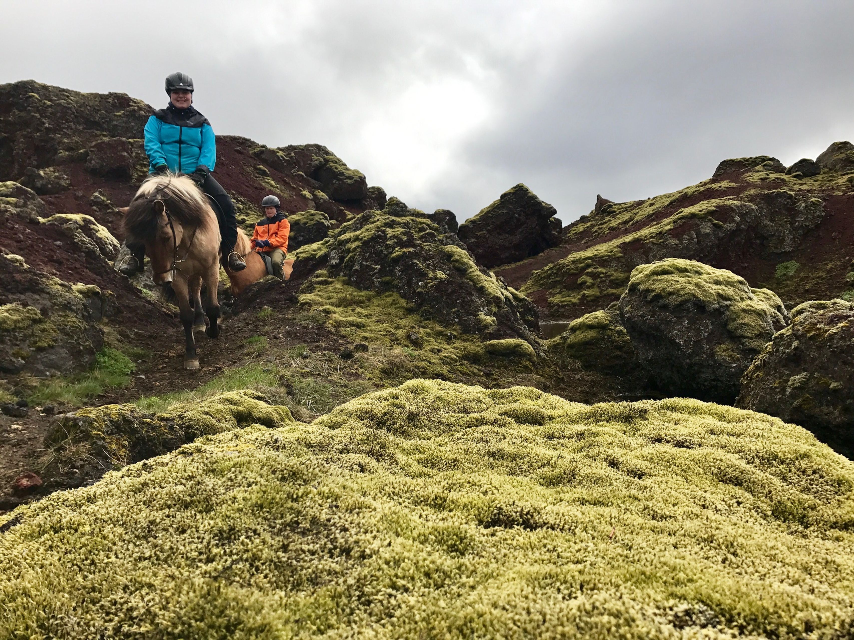 Horse riding in a lava field in Iceland 