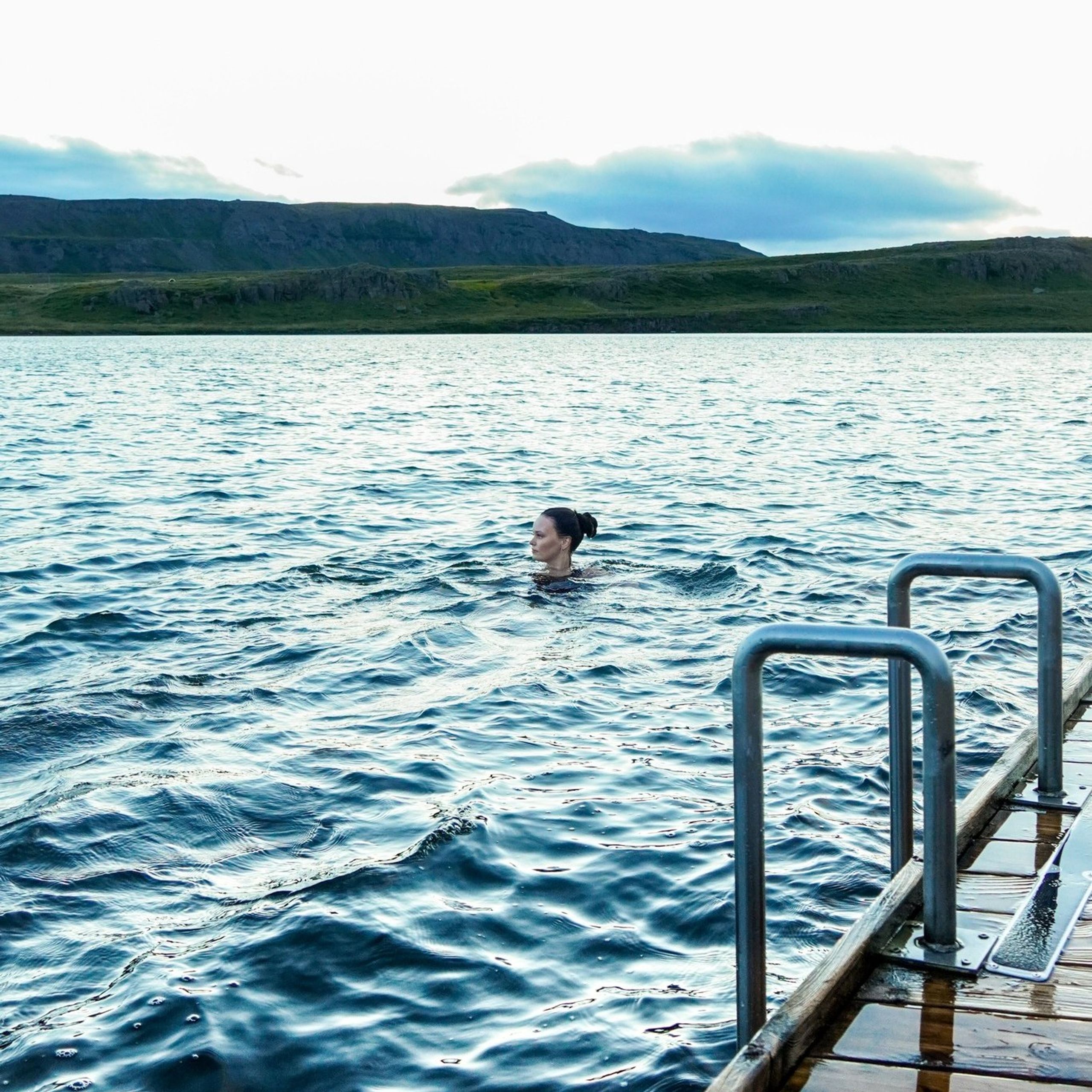 Girl swimming in Lake Urriðavatn