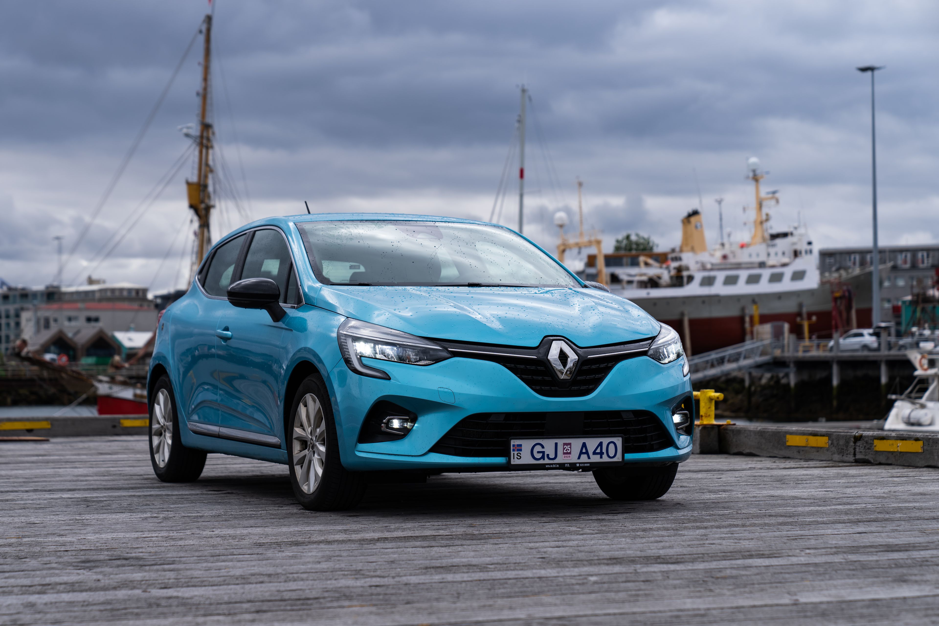 A blue Renault Clio iceland rental car parked in Iceland