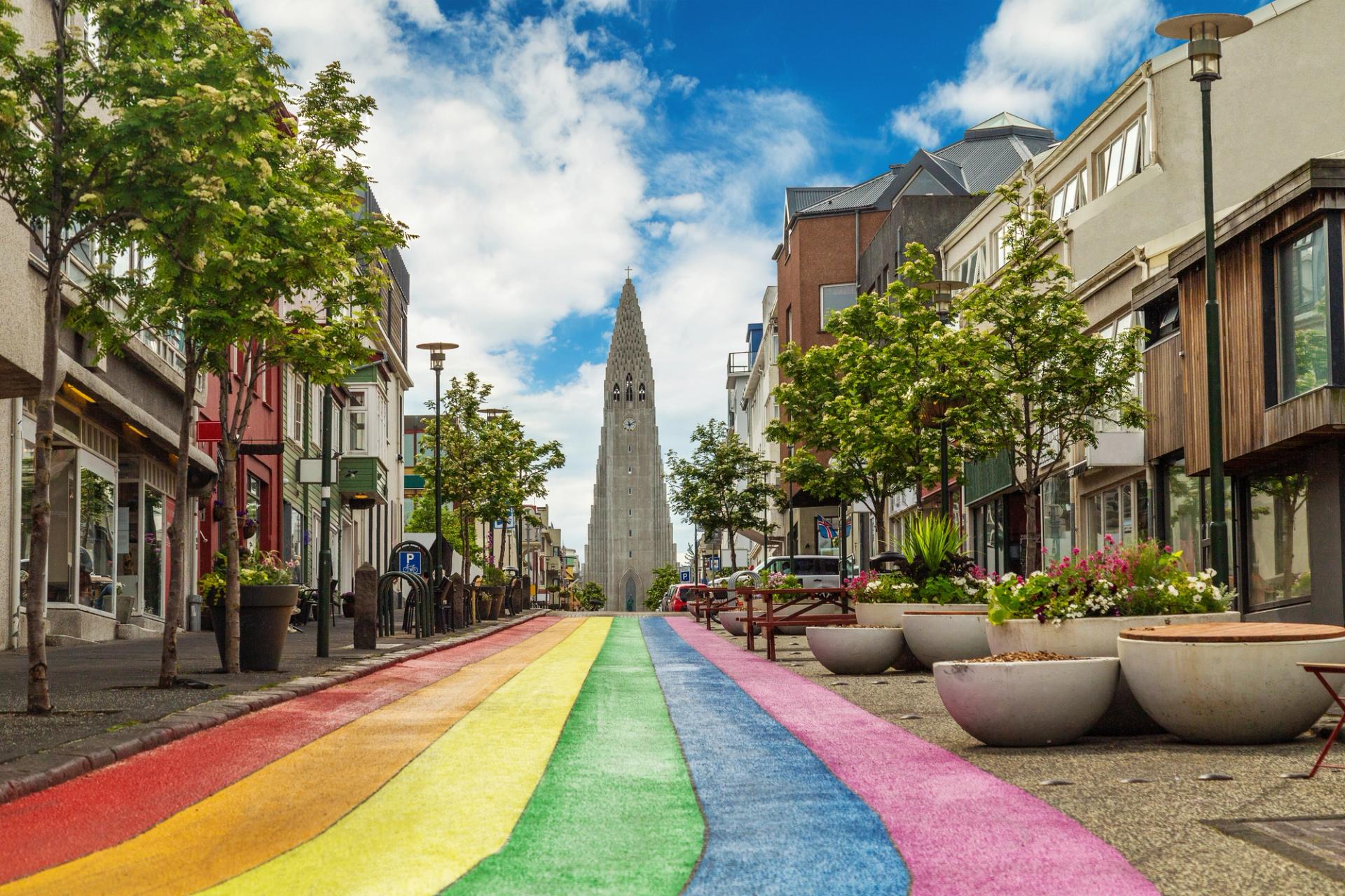 The rainbow street of reykjavik, and its famous church 