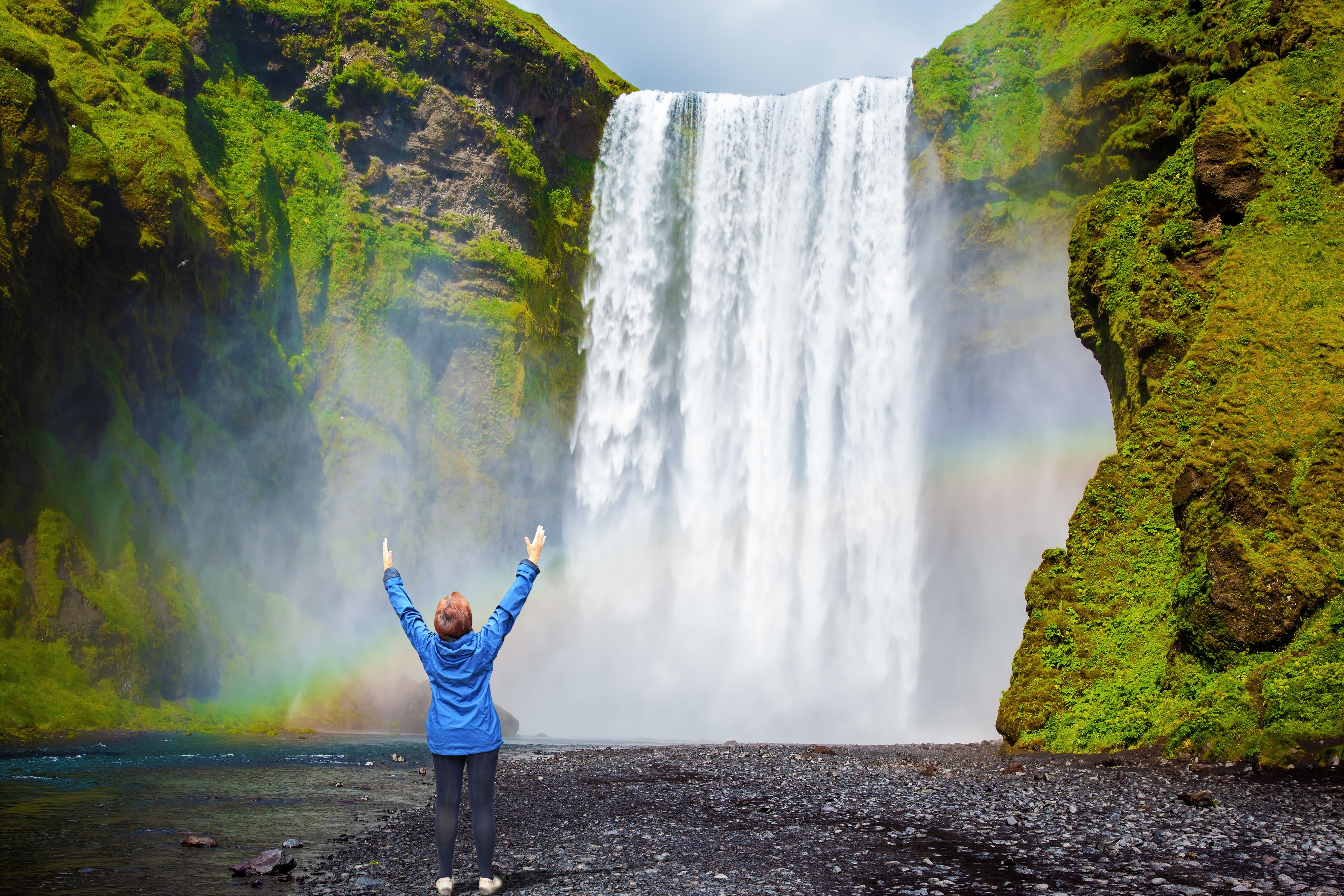 Woman in front of waterfall in Iceland