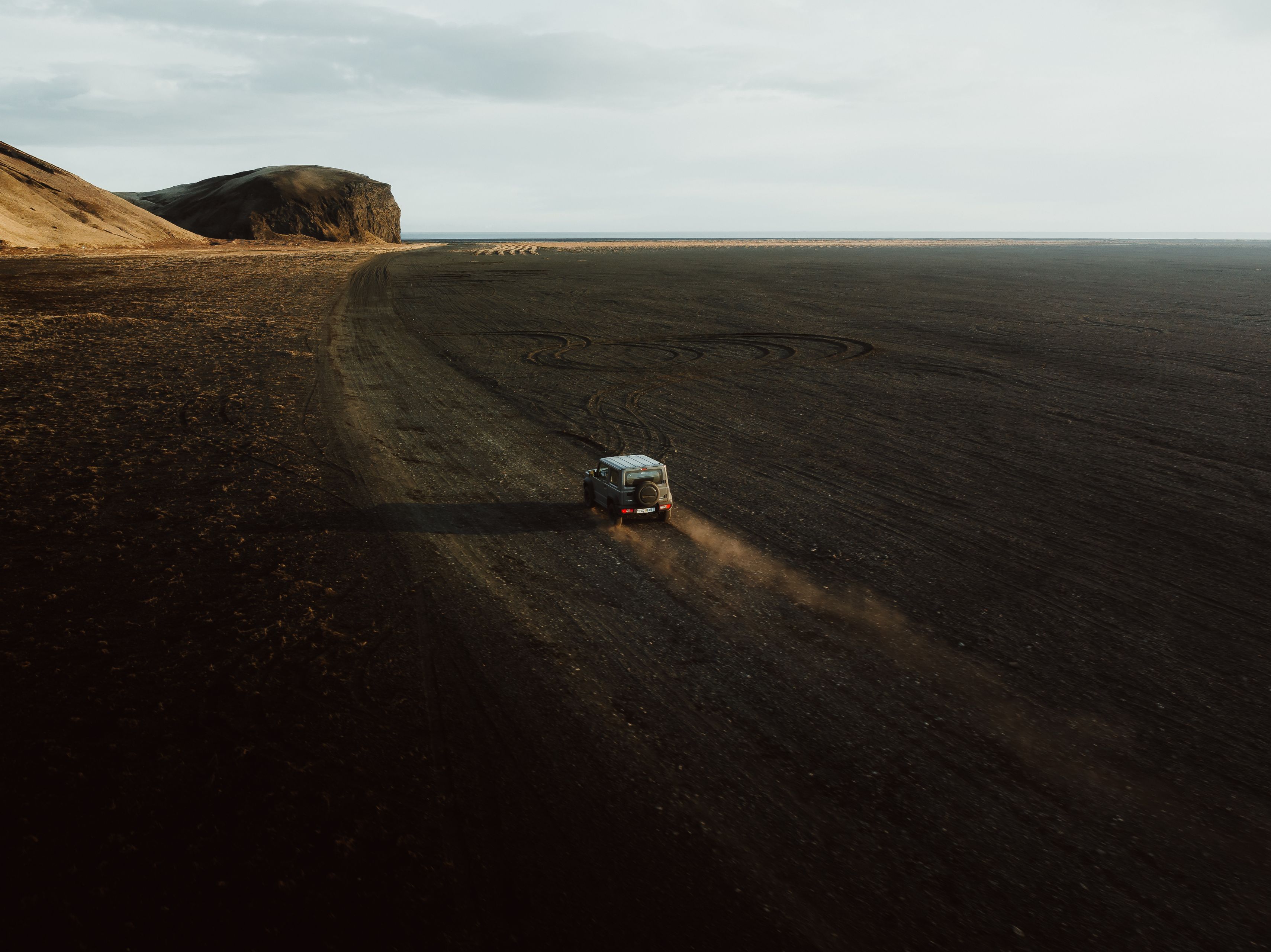 4x4 car navigating through rough Icelandic terrain