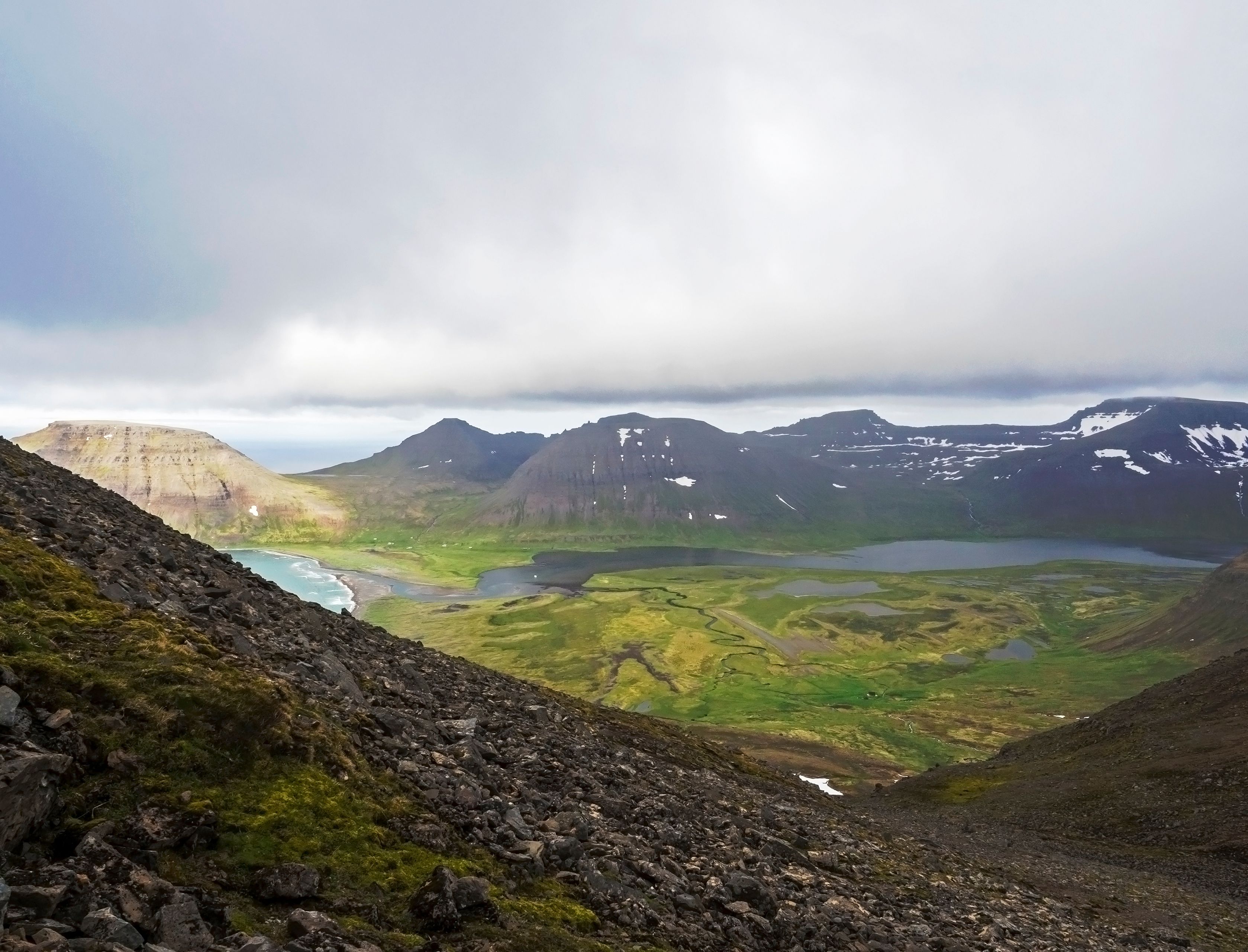 View on beautiful snow covered cliffs and fljotsvatn lake in Fljotavik cove in Hornstrandir