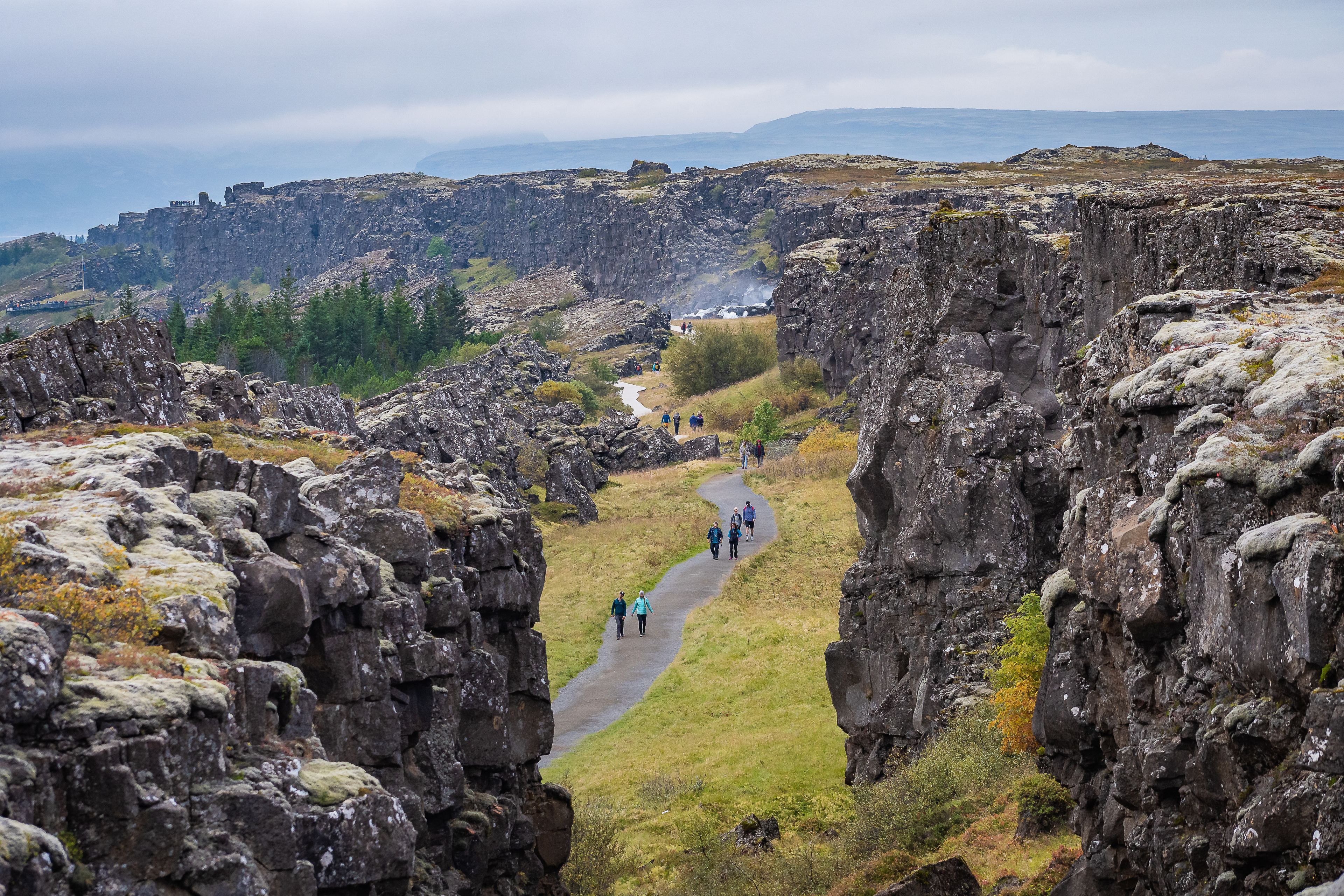 People walking through Thingvellir National Park