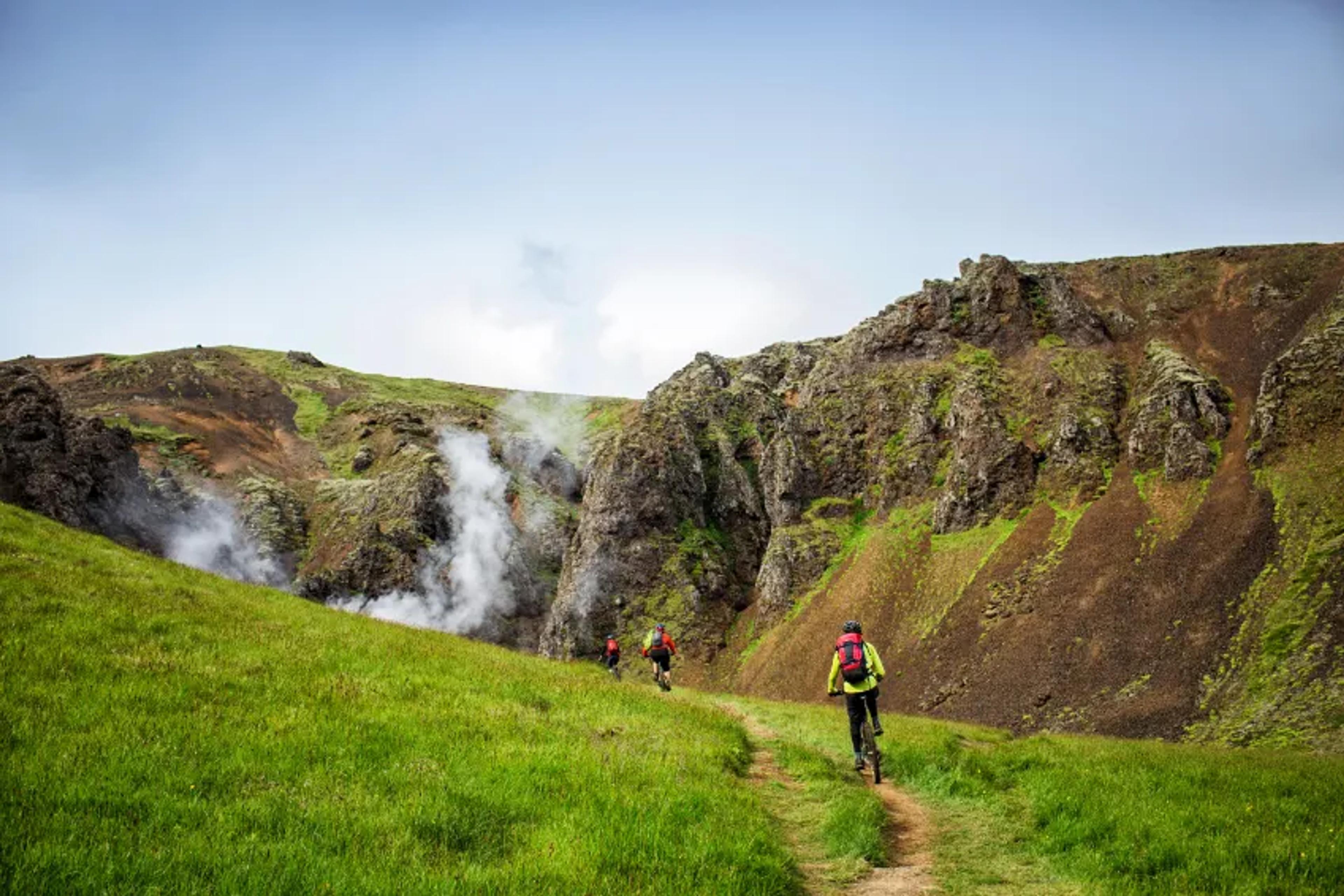 Biking with friends in a beautiful steam valley in Iceland