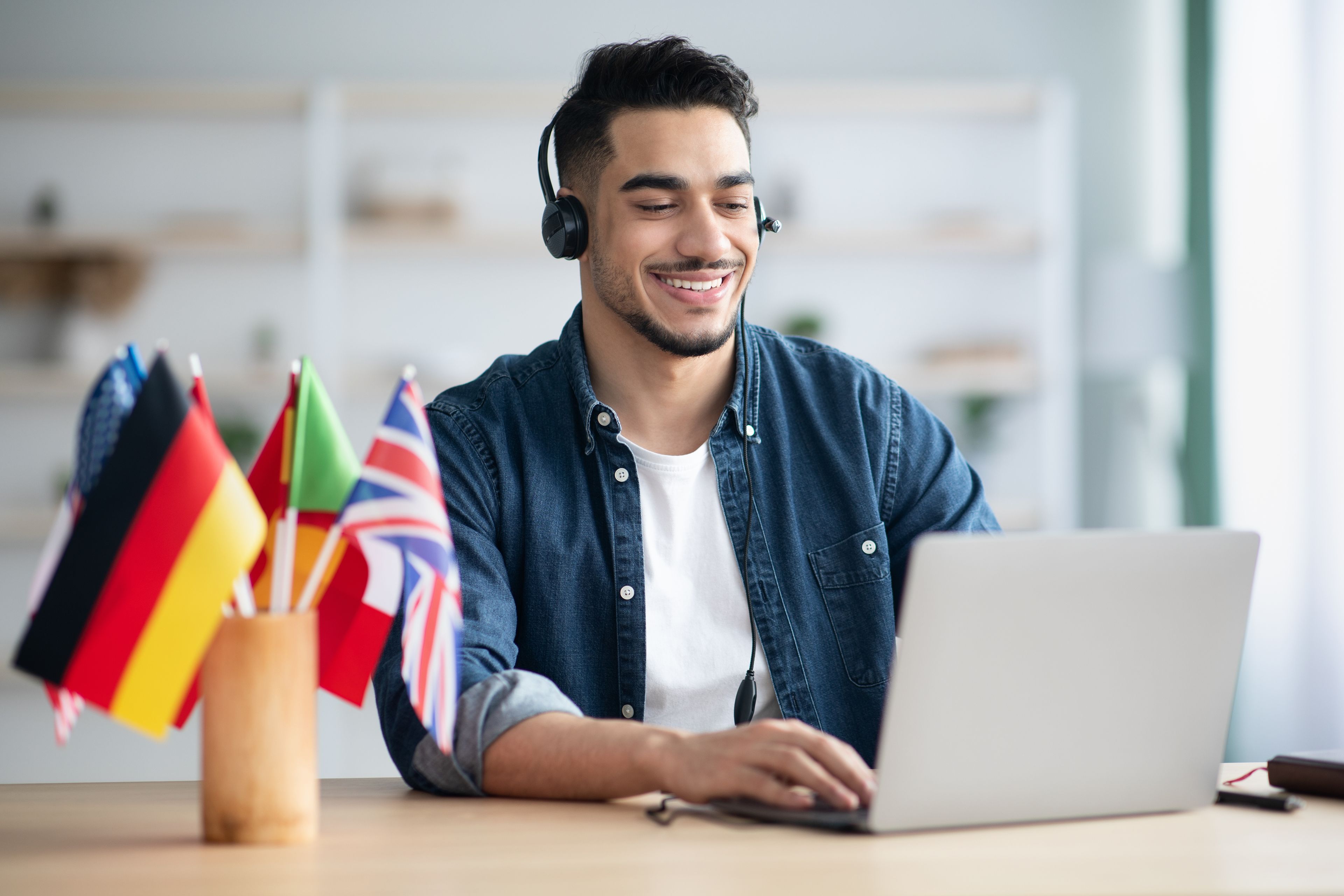 Man in front of a computer studying a new language