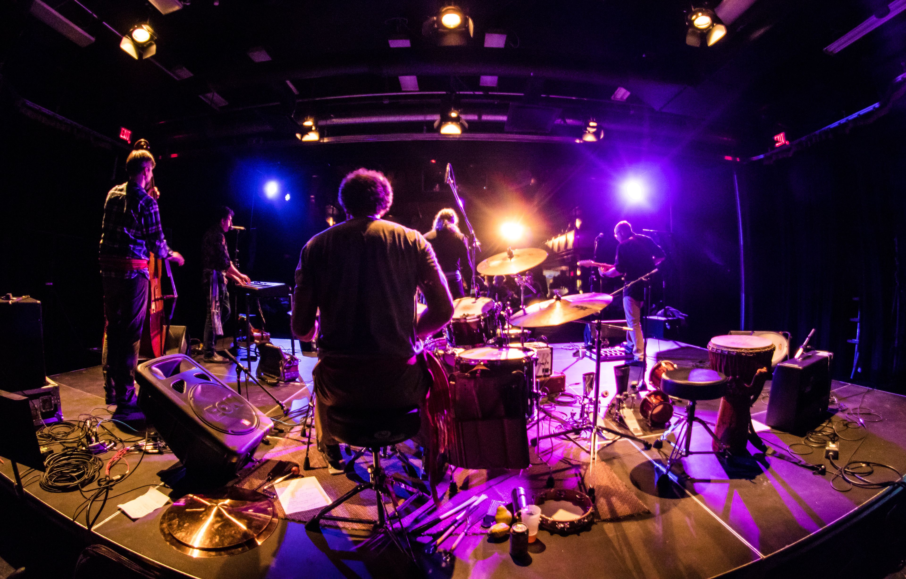 Band playing a concert at a bar