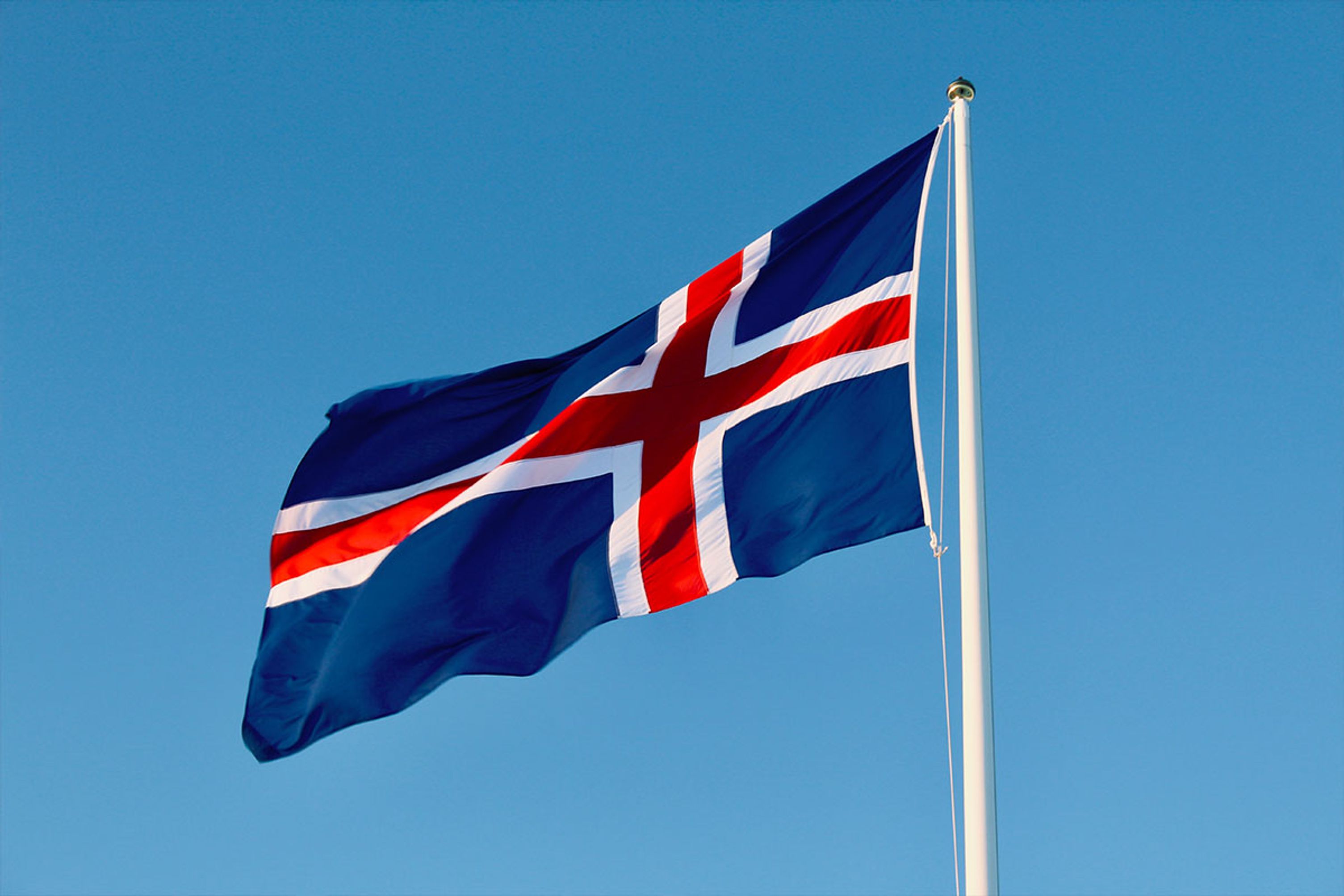 Blue, red and white Icelandic flag on a nice summer day