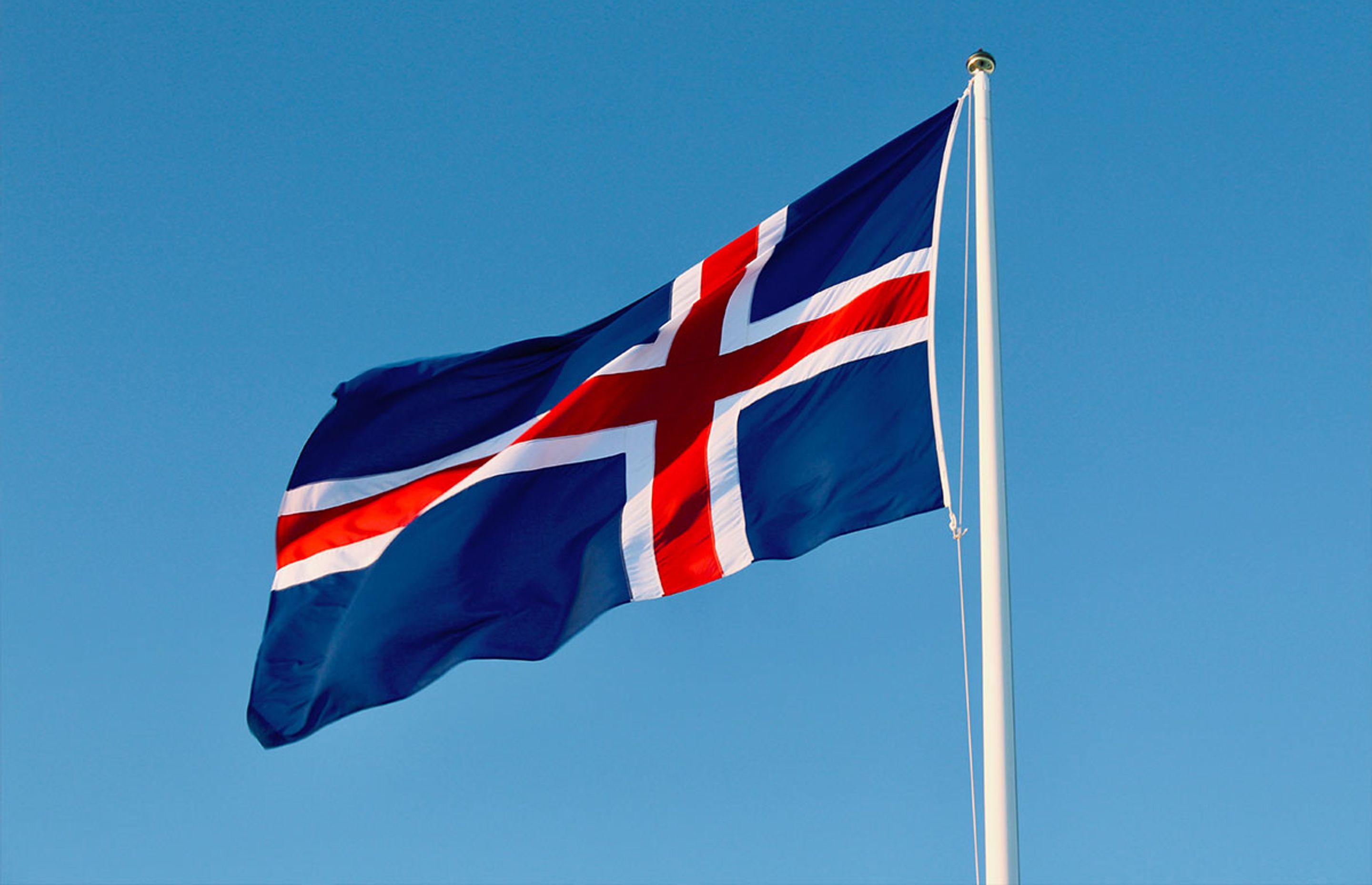Blue, red and white Icelandic flag on a nice summer day