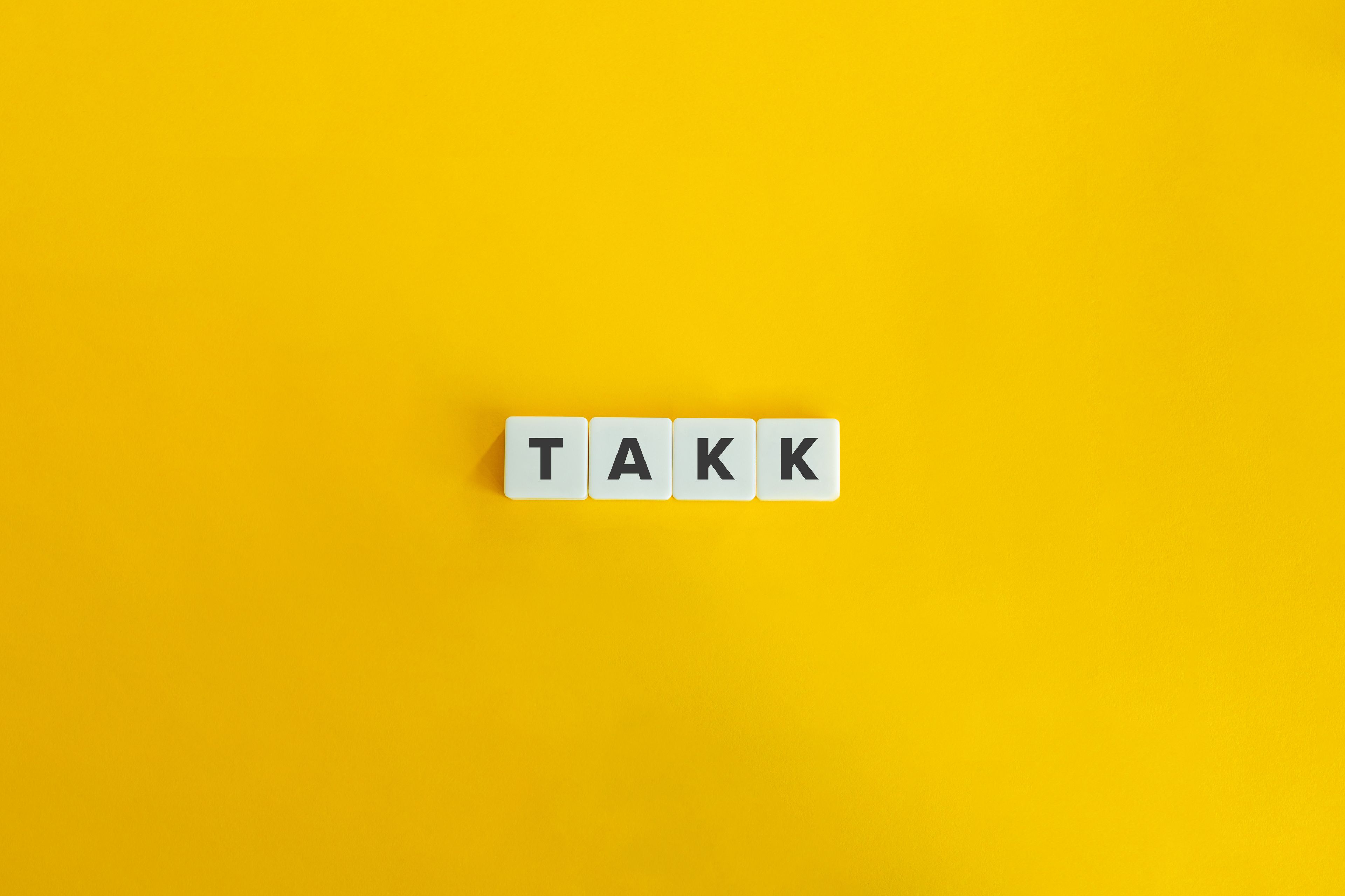 Letters making the word "takk"