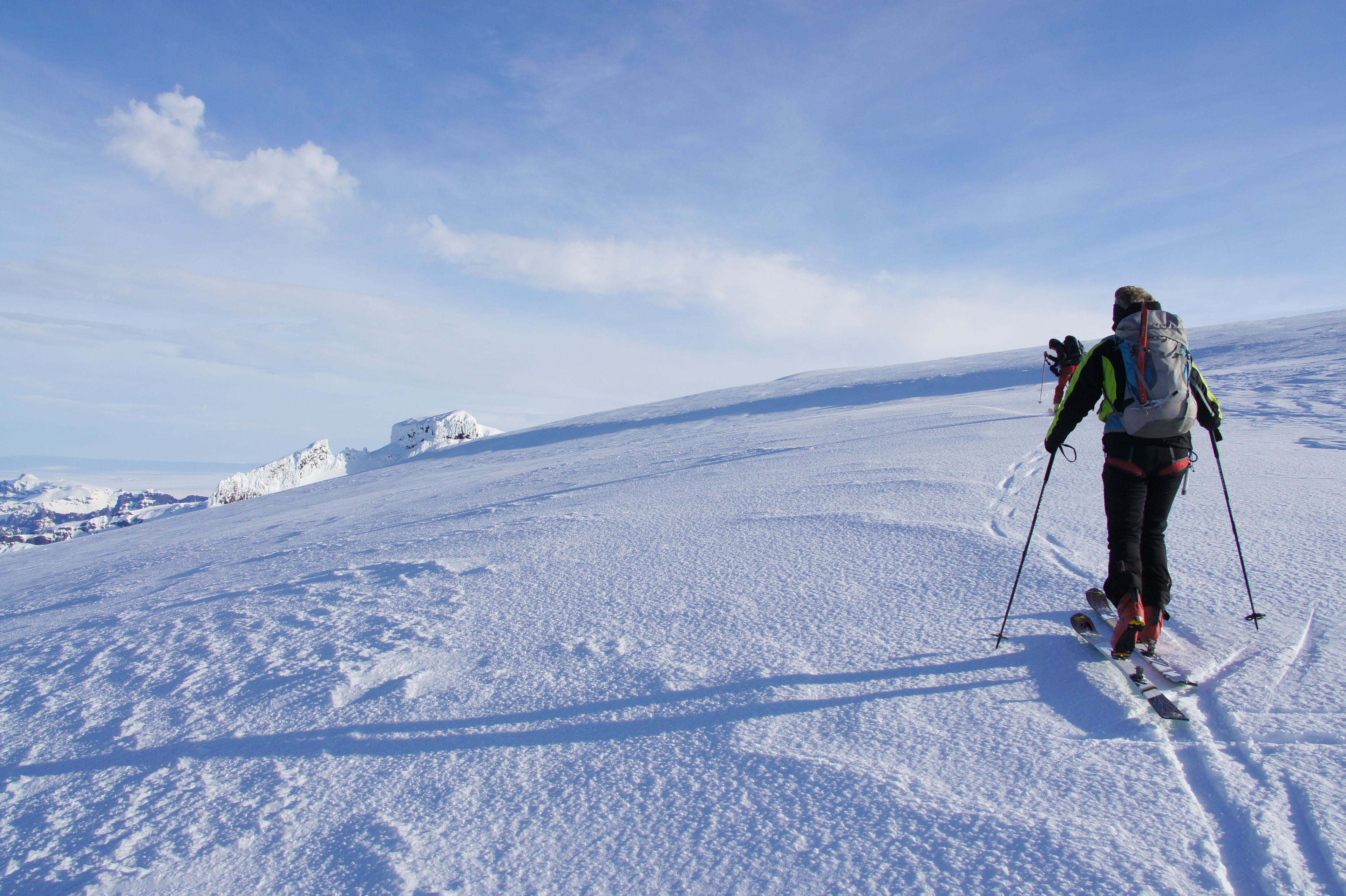 Two people glacier skiing in Iceland