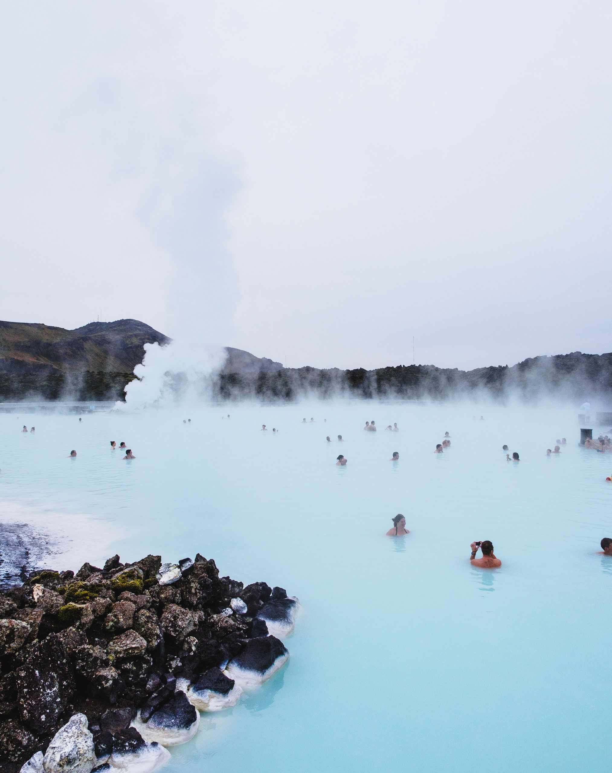 People relaxing in Blue Lagoon hot spring in Iceland