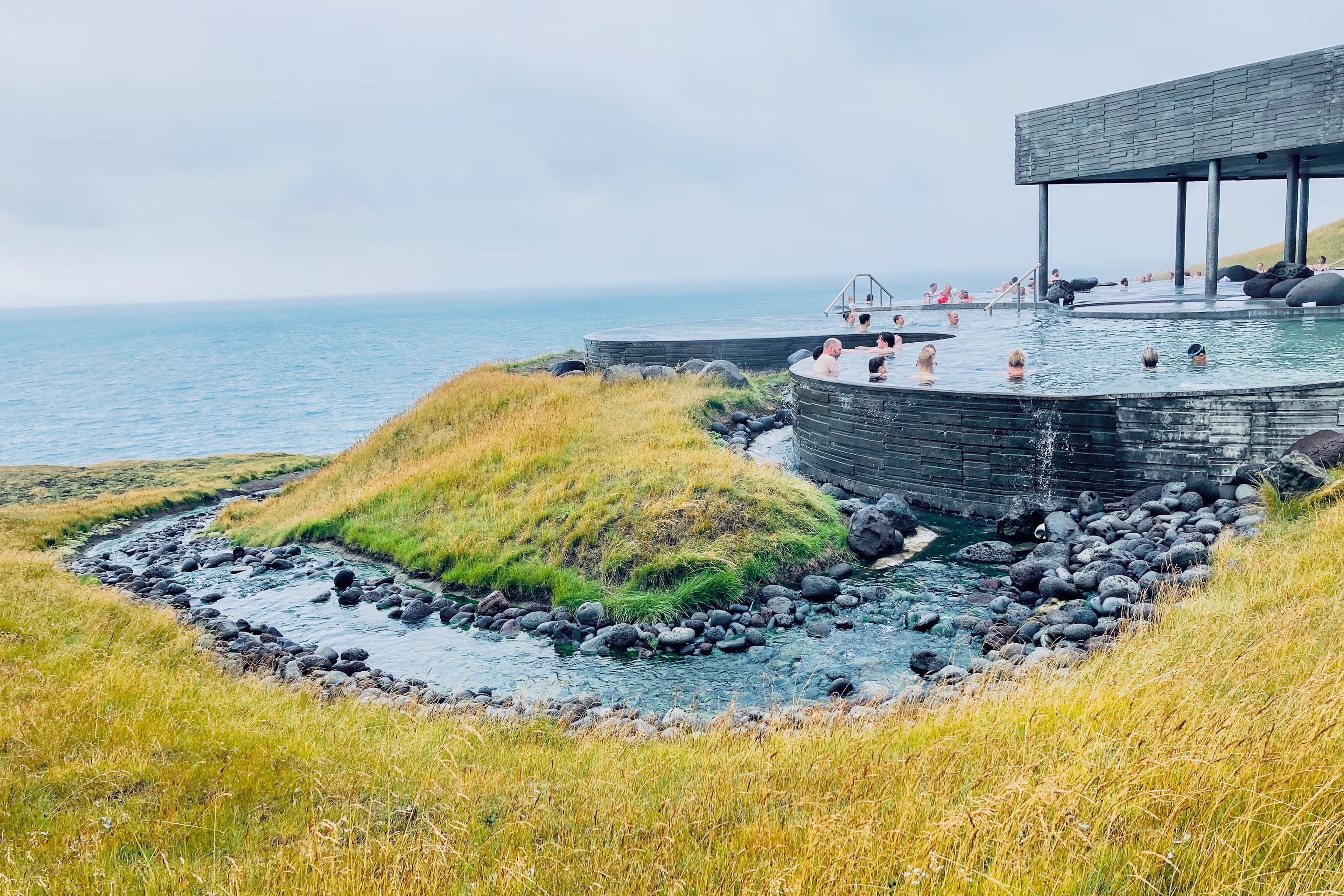 Geosea Baths with people inside on a cloudy day