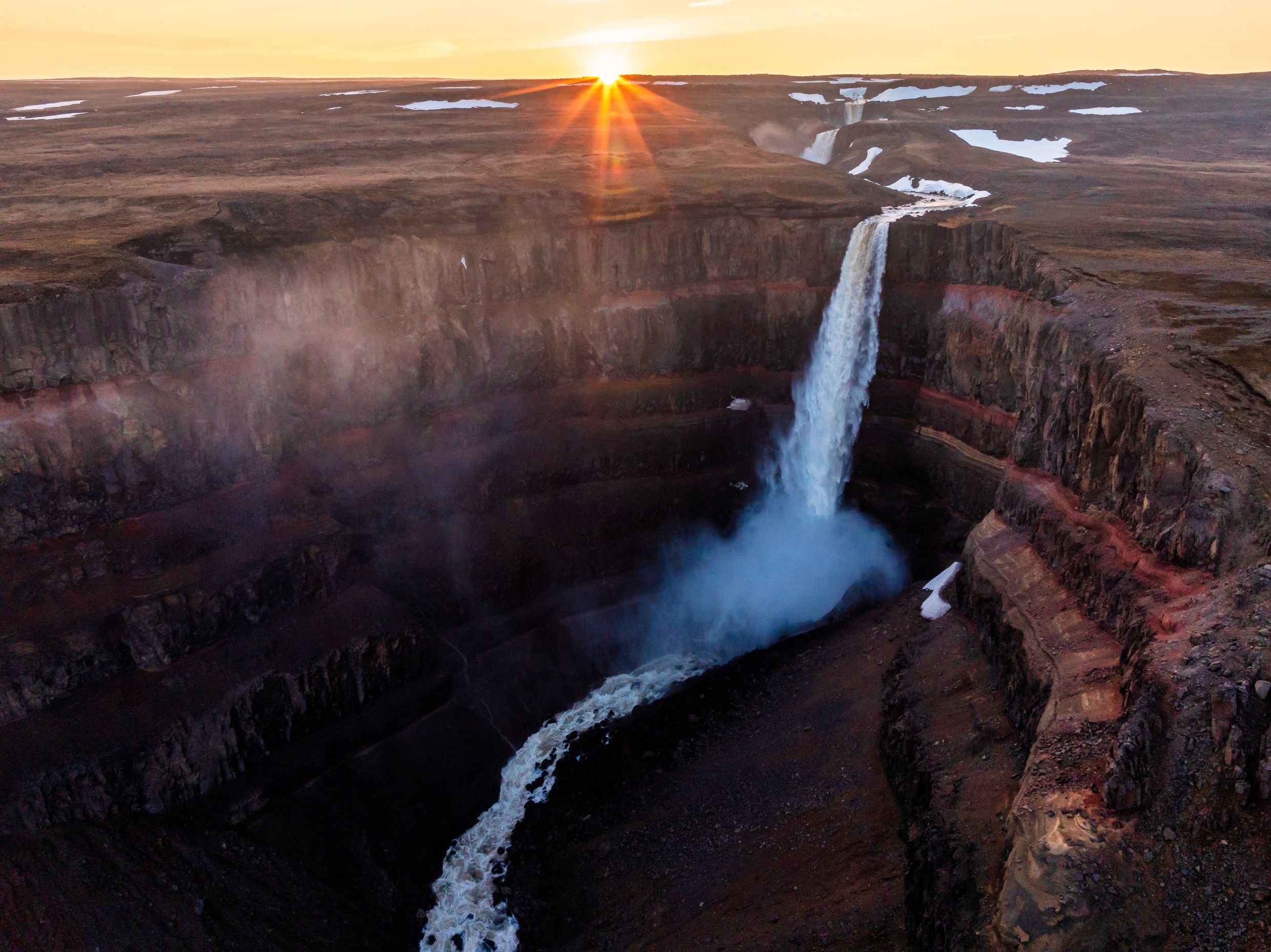 Hengifoss waterfall at sunrise