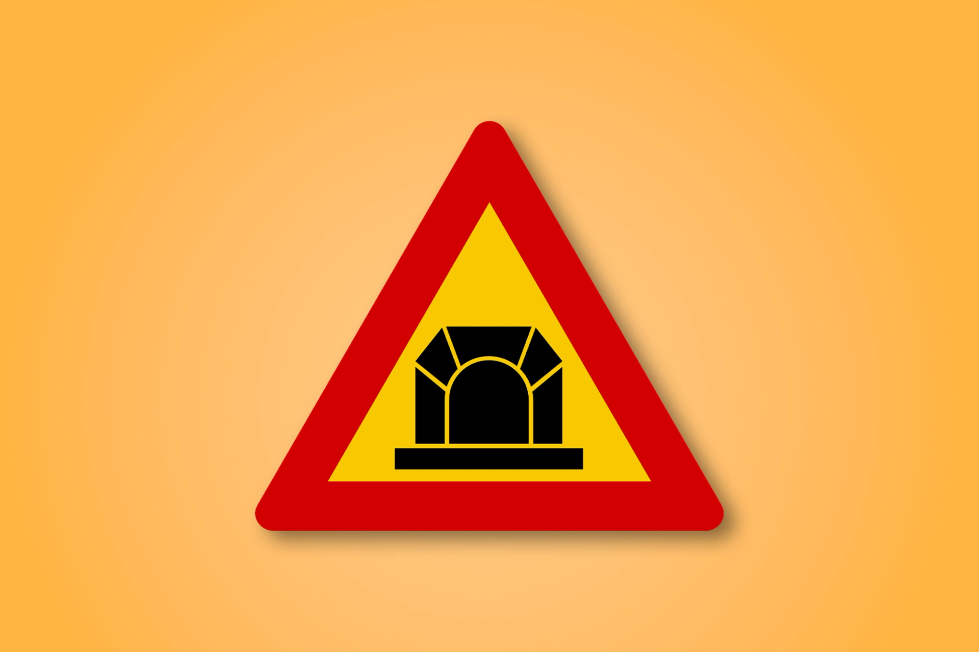 Red and yellow triangle road sign with a tunnel in the middle. This road sign means Tunnel Ahead