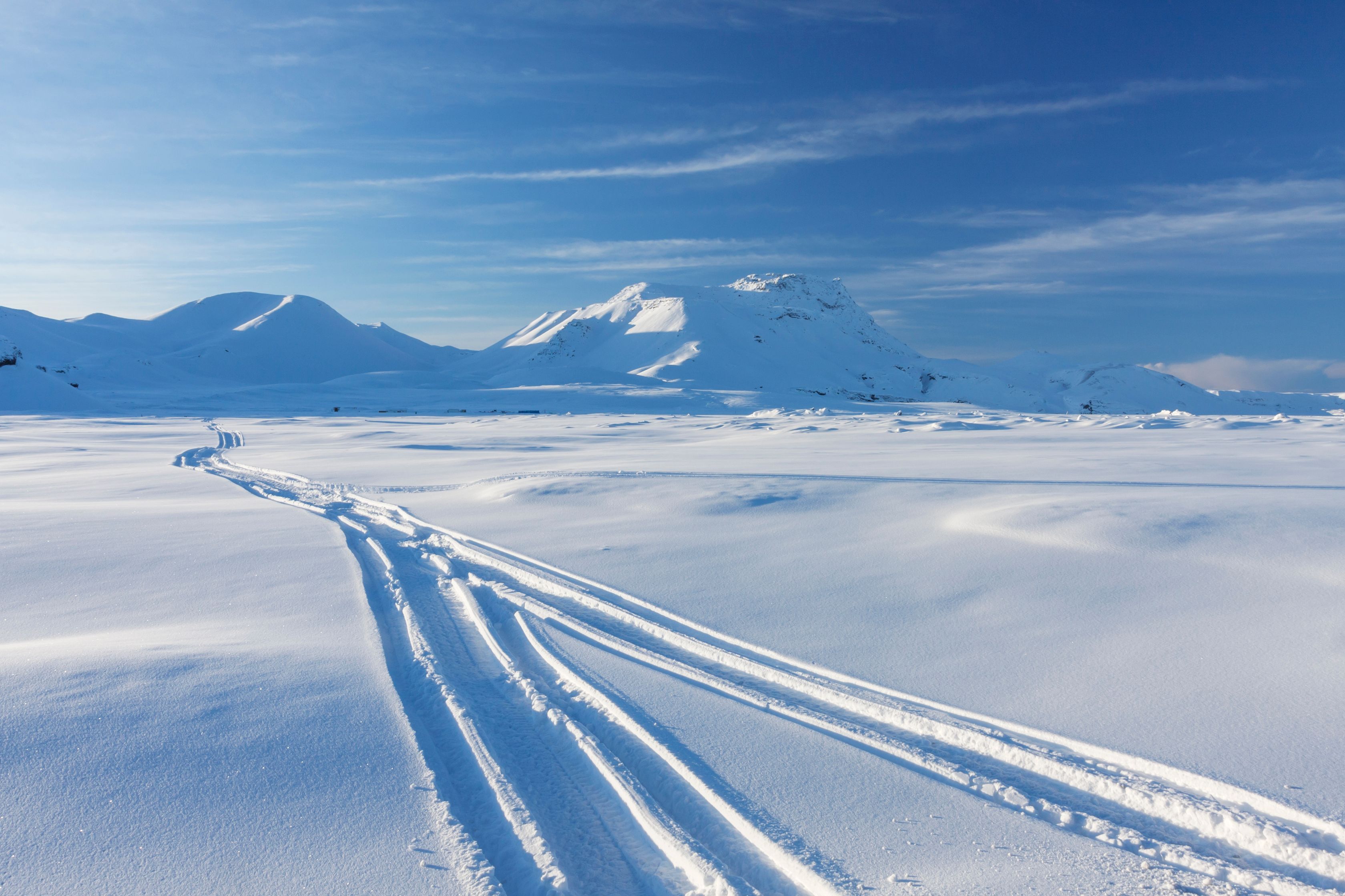 Snowmobile tracks in beautiful Blue Mountains Iceland.