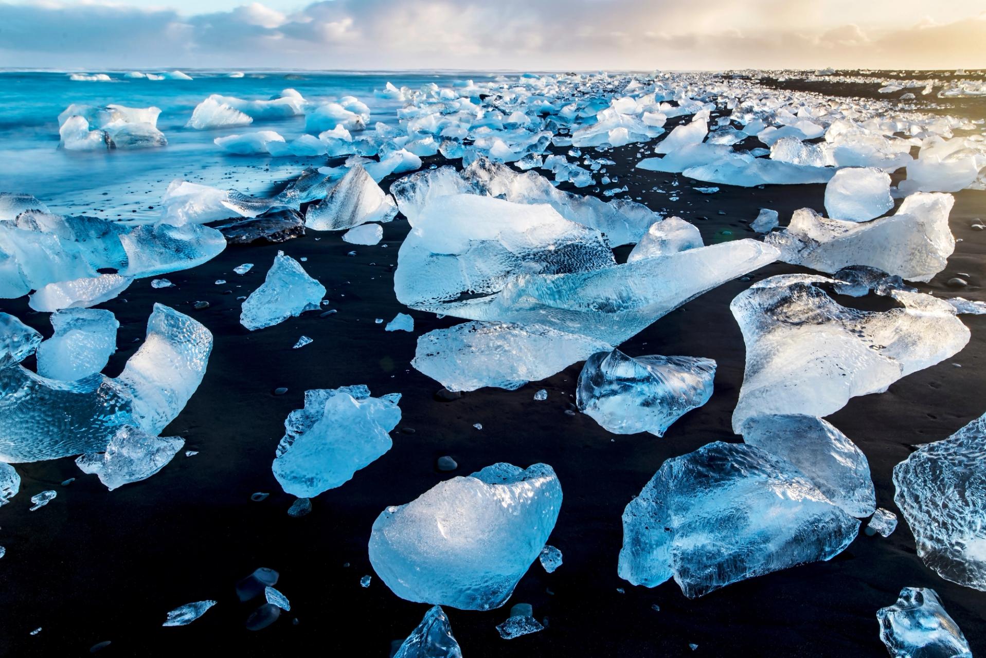 Diamond Beach in Iceland, where the black sand contrasts with the sparkling ice chunks scattered along the shore, creating a breathtaking natural wonder.