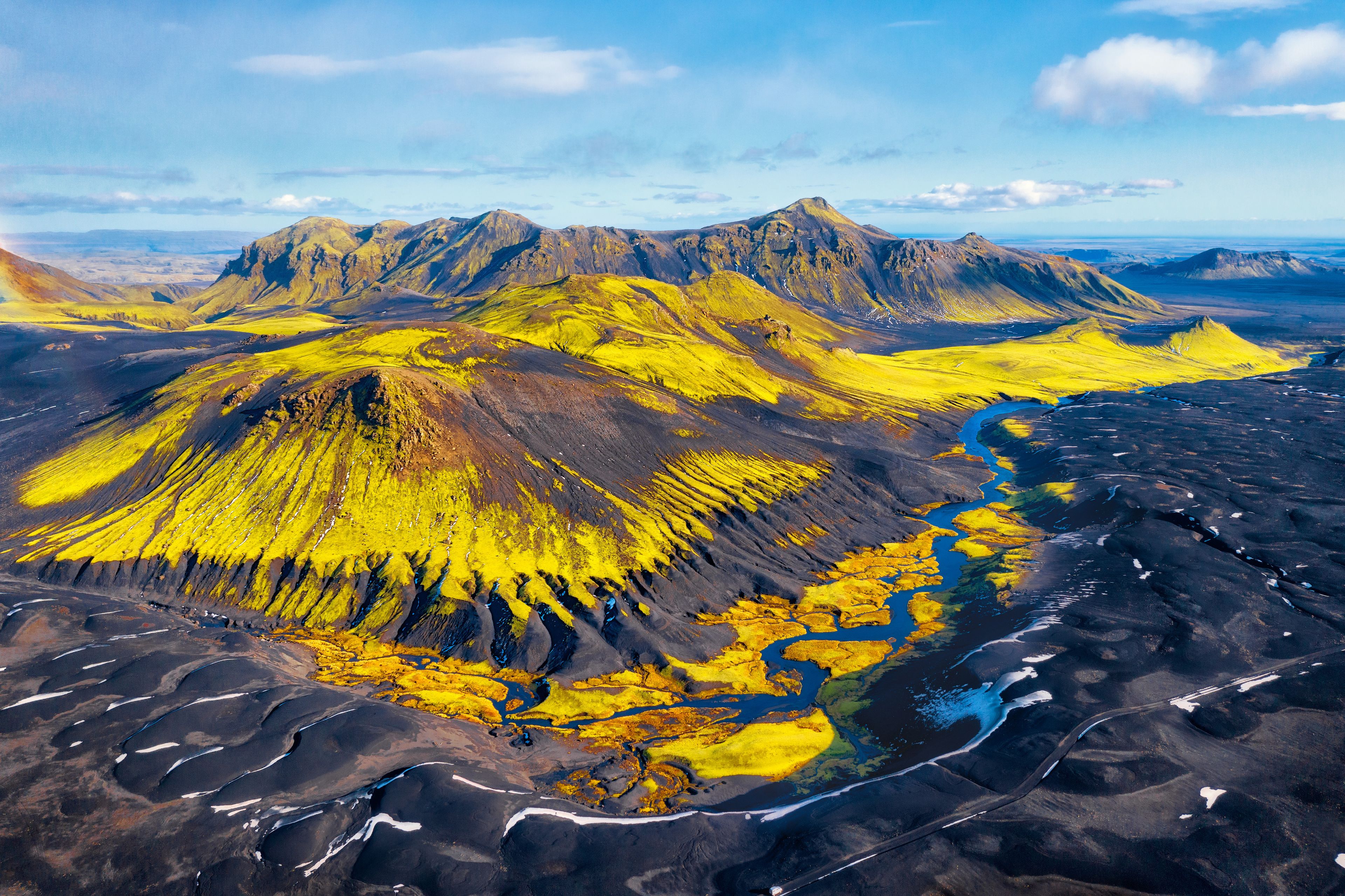 grassy hills and volcanic rock