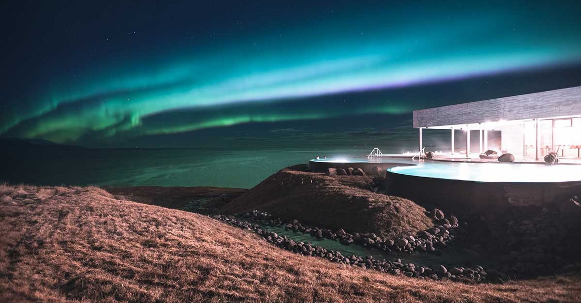 Geothermal swimming pool in the north of Iceland, and exceptional view on the Northern Lights
