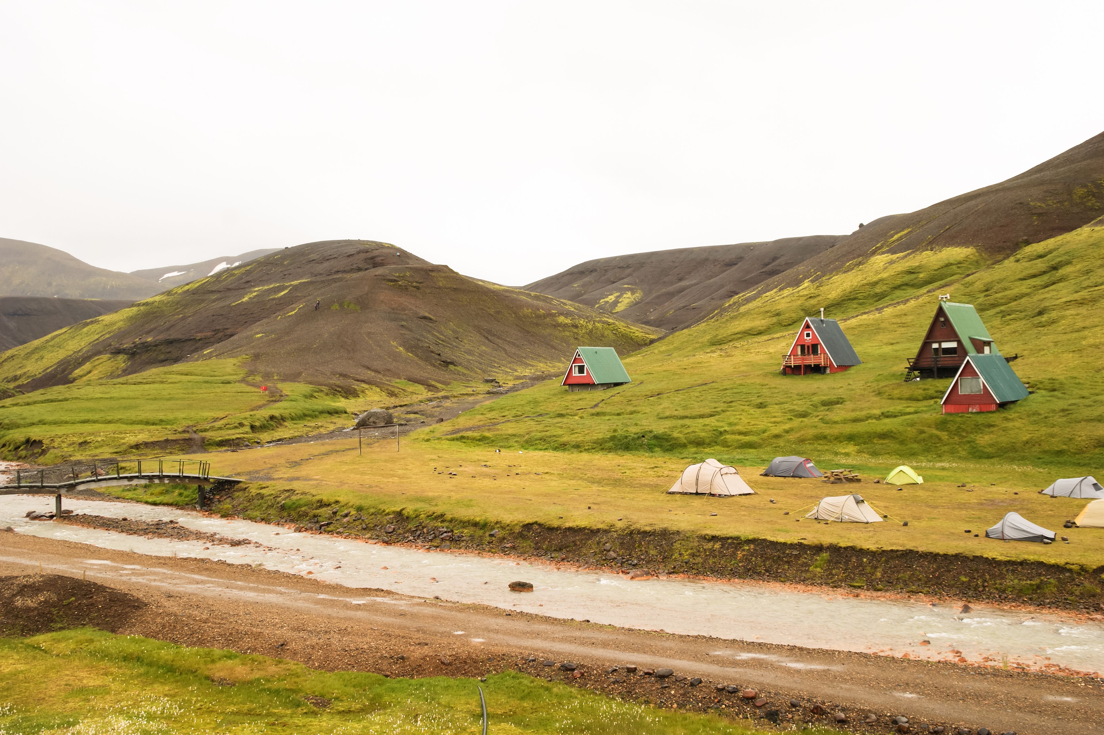 Red lodges in Kerlingarfjoll with tents outside