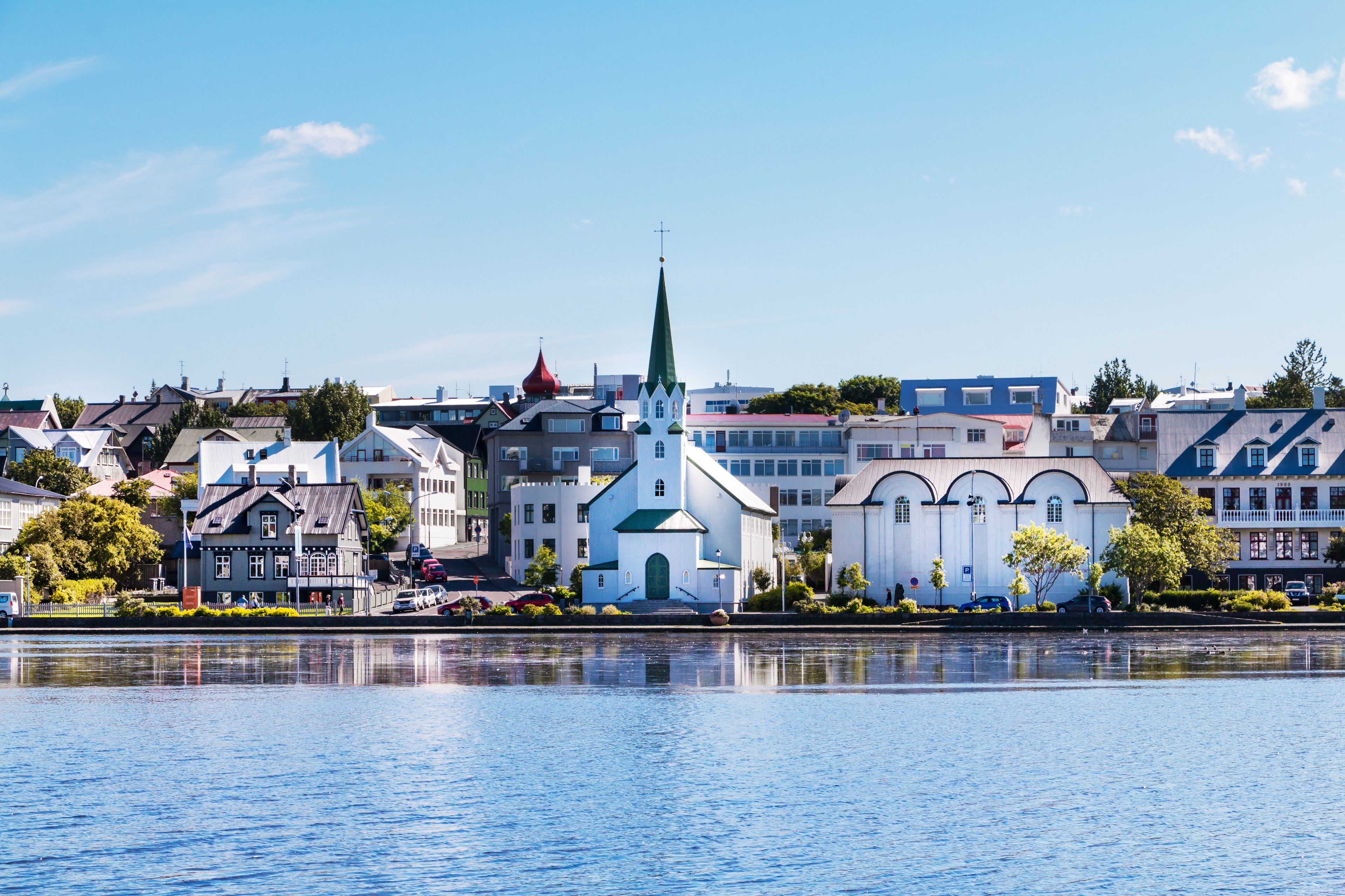 view on the lake quay of Reykjavik and its downtown houses