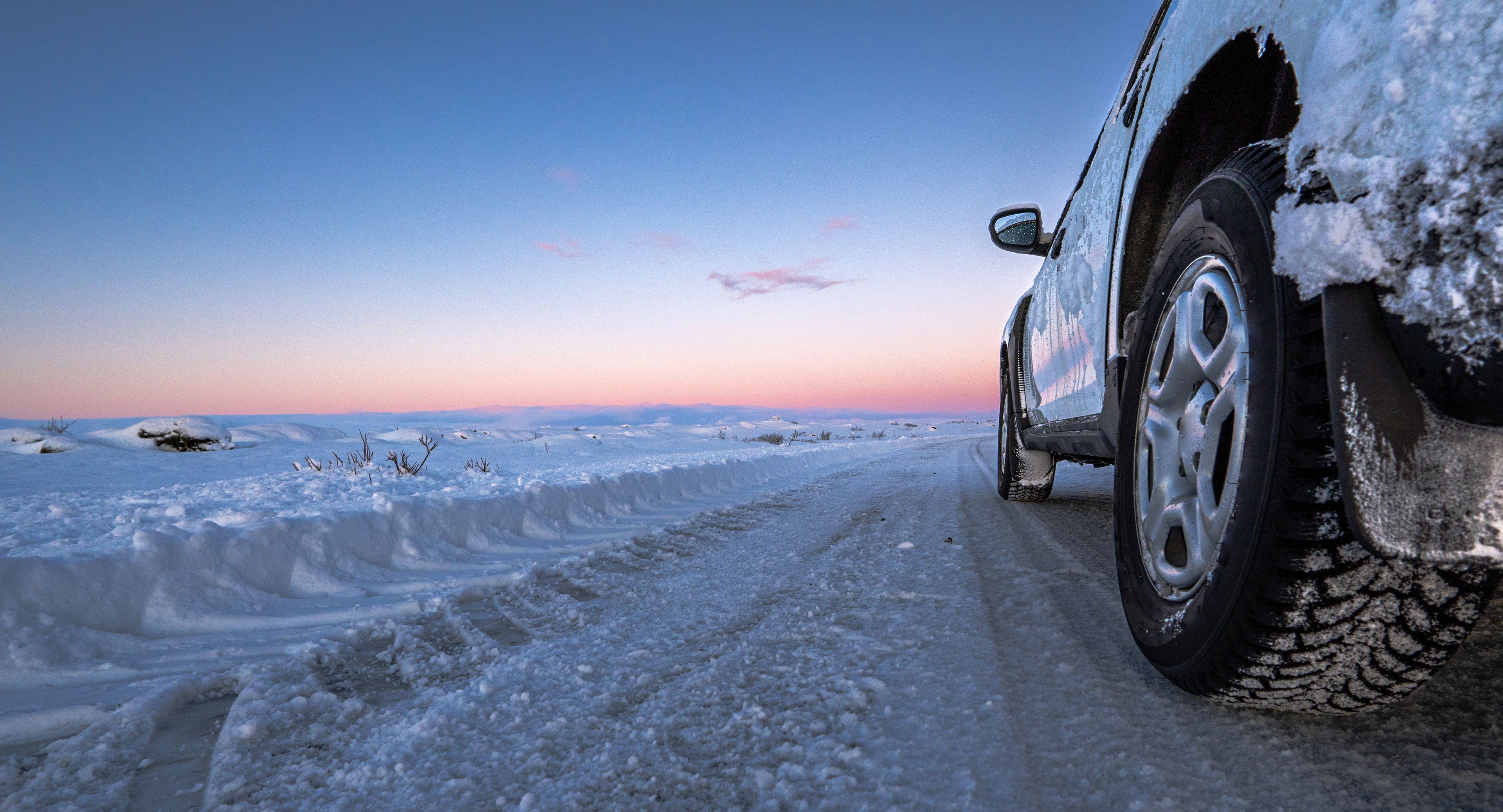 Sunset and car under the snow in Iceland