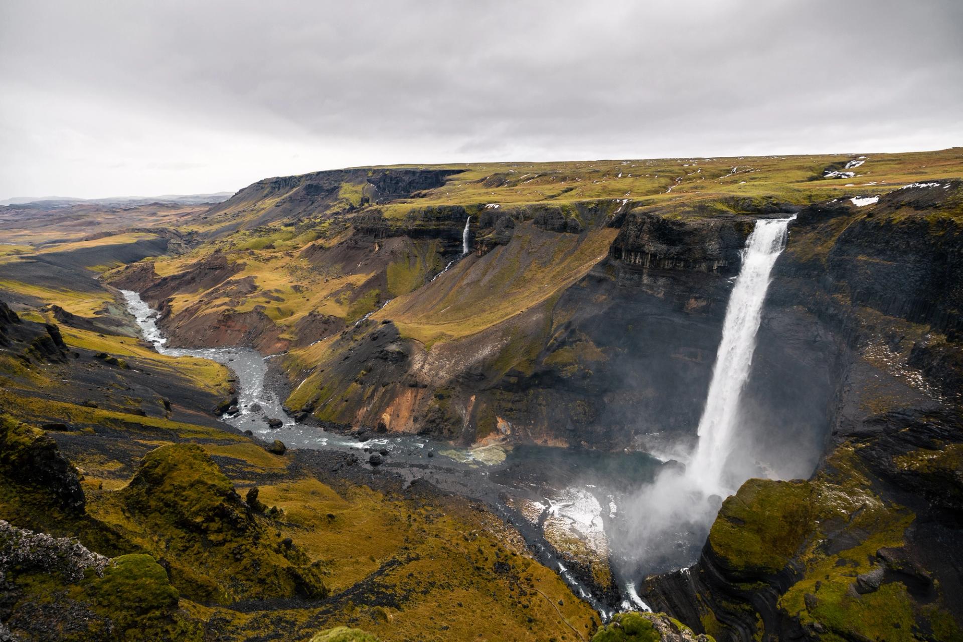 Háifoss waterfall plunging into a deep canyon with dramatic landscape