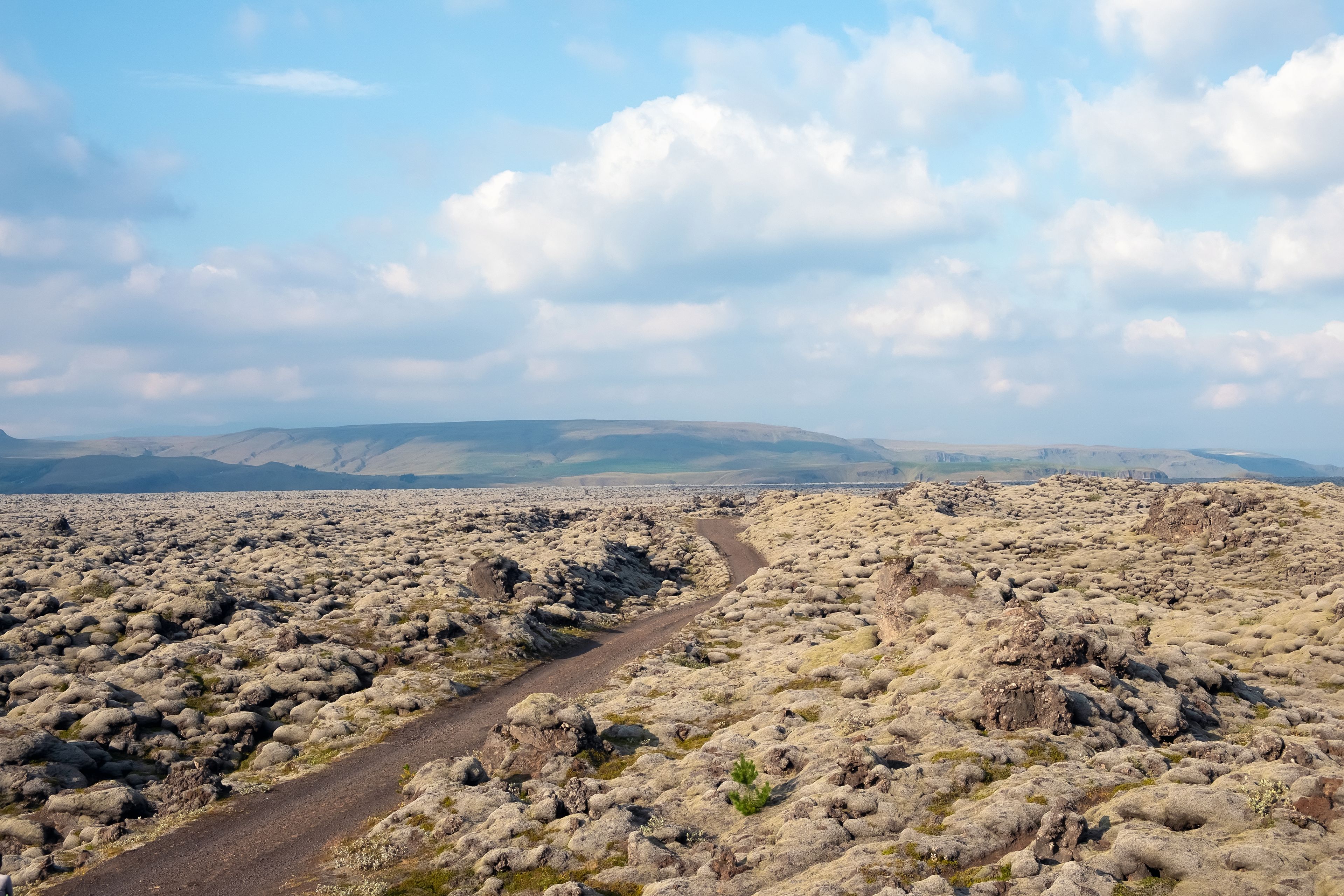 View of a dirt road among lava fields in the Reykjanes Peninsula