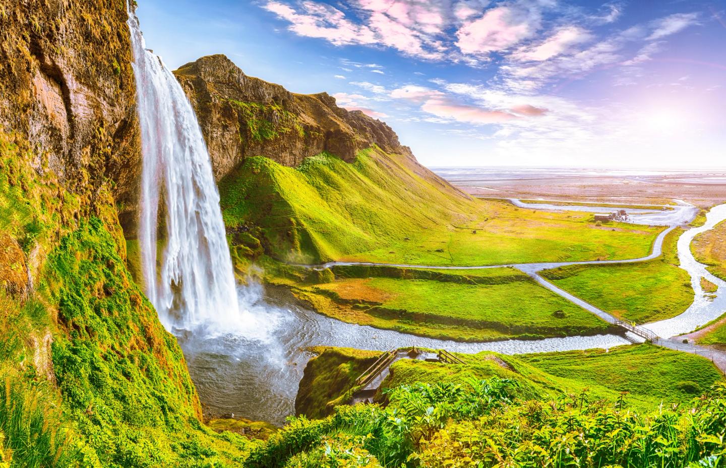 Seljalandsfoss waterfall in Iceland during sunny day.