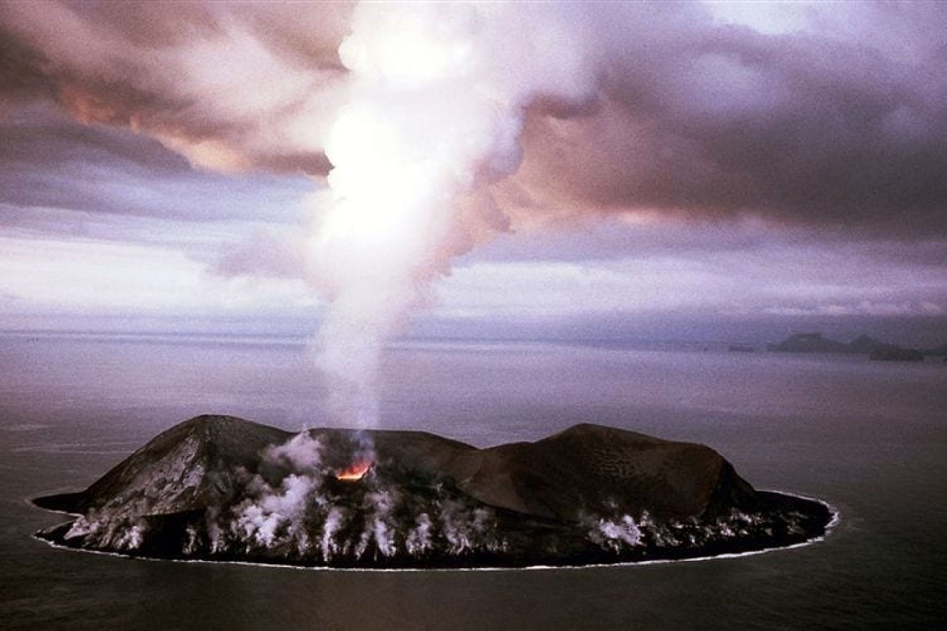 Picture from above of the Sutrsey volcano in eruption in 1963 from the westman islands