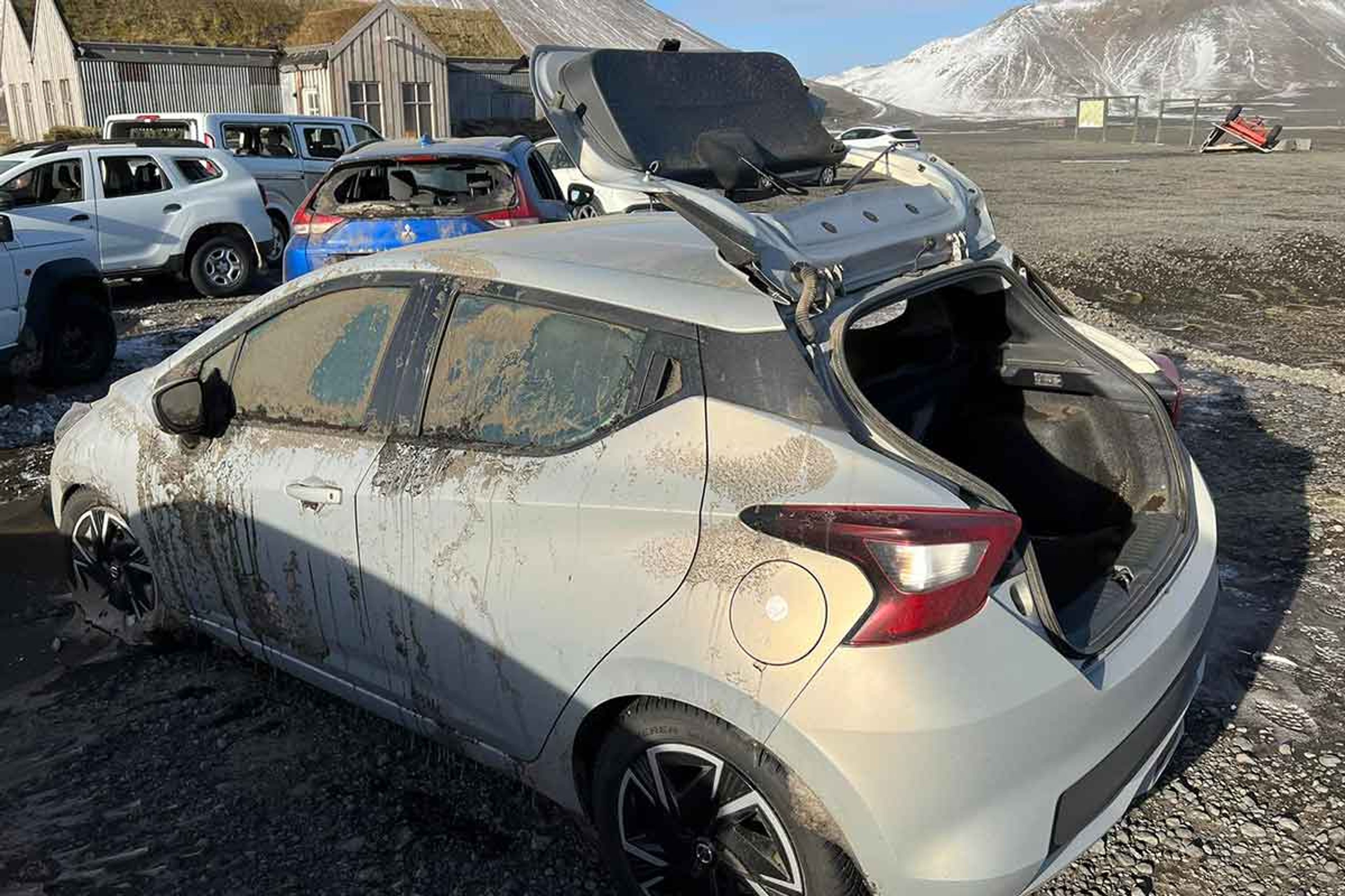 Iceland rental car that is stuck and damaged due to a huge sand and ash storm in Iceland