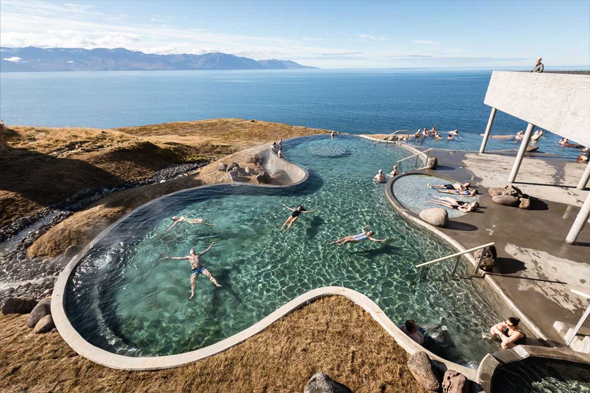 Indulge in the ultimate relaxation at GeoSea hot spring in North Iceland. With stunning views of the ocean and the surrounding mountains, this geothermal spa offers a unique and rejuvenating experience. Take a dip in the warm waters and let your worries melt away.