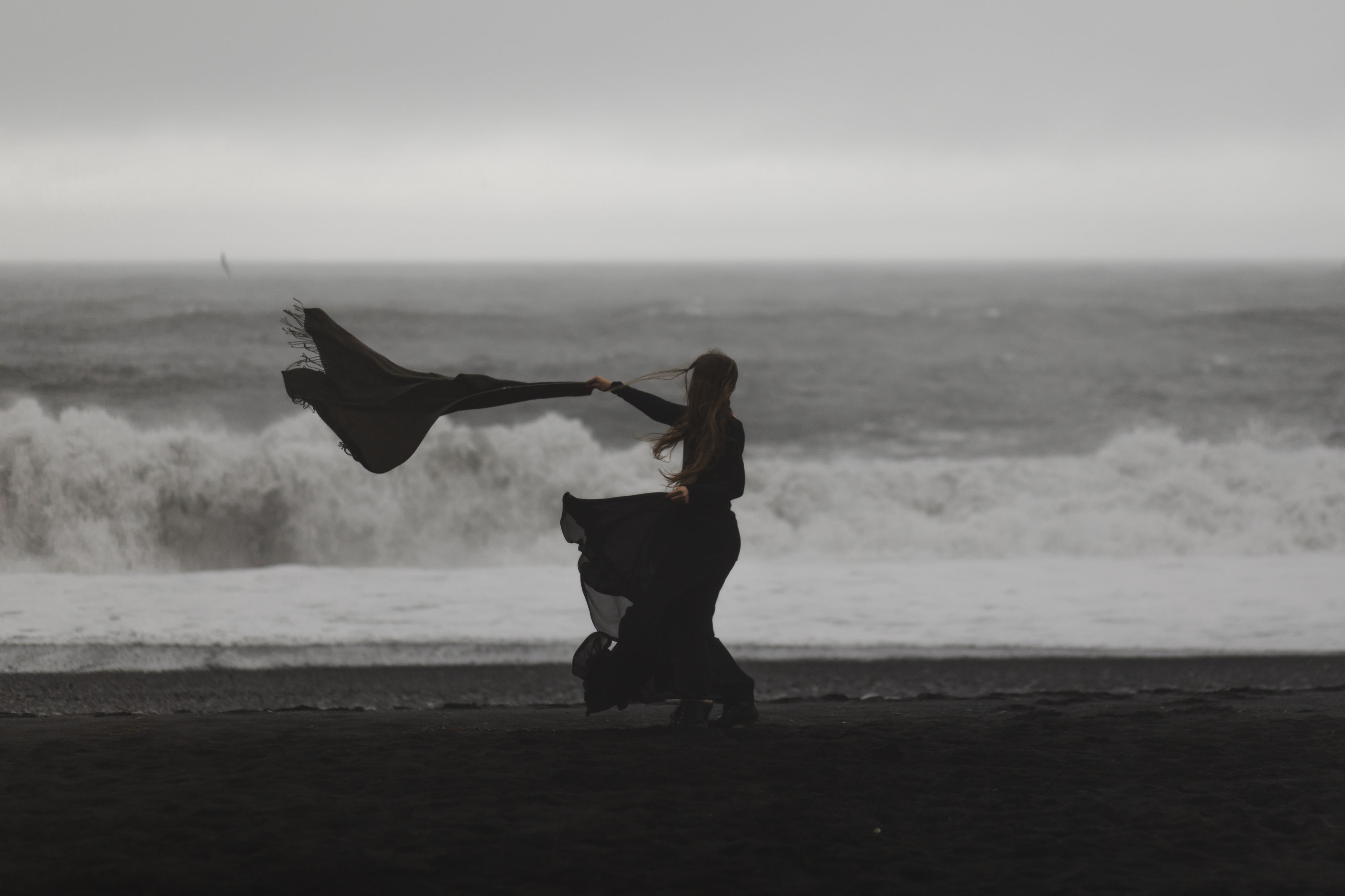 Girl at the beach in a windy day in Iceland