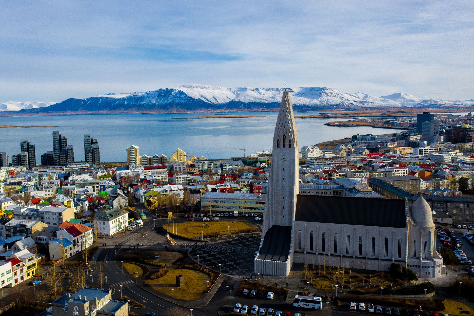 Hallgrímskirkja's imposing facade and unique architecture with Reykjavík cityscape in the background