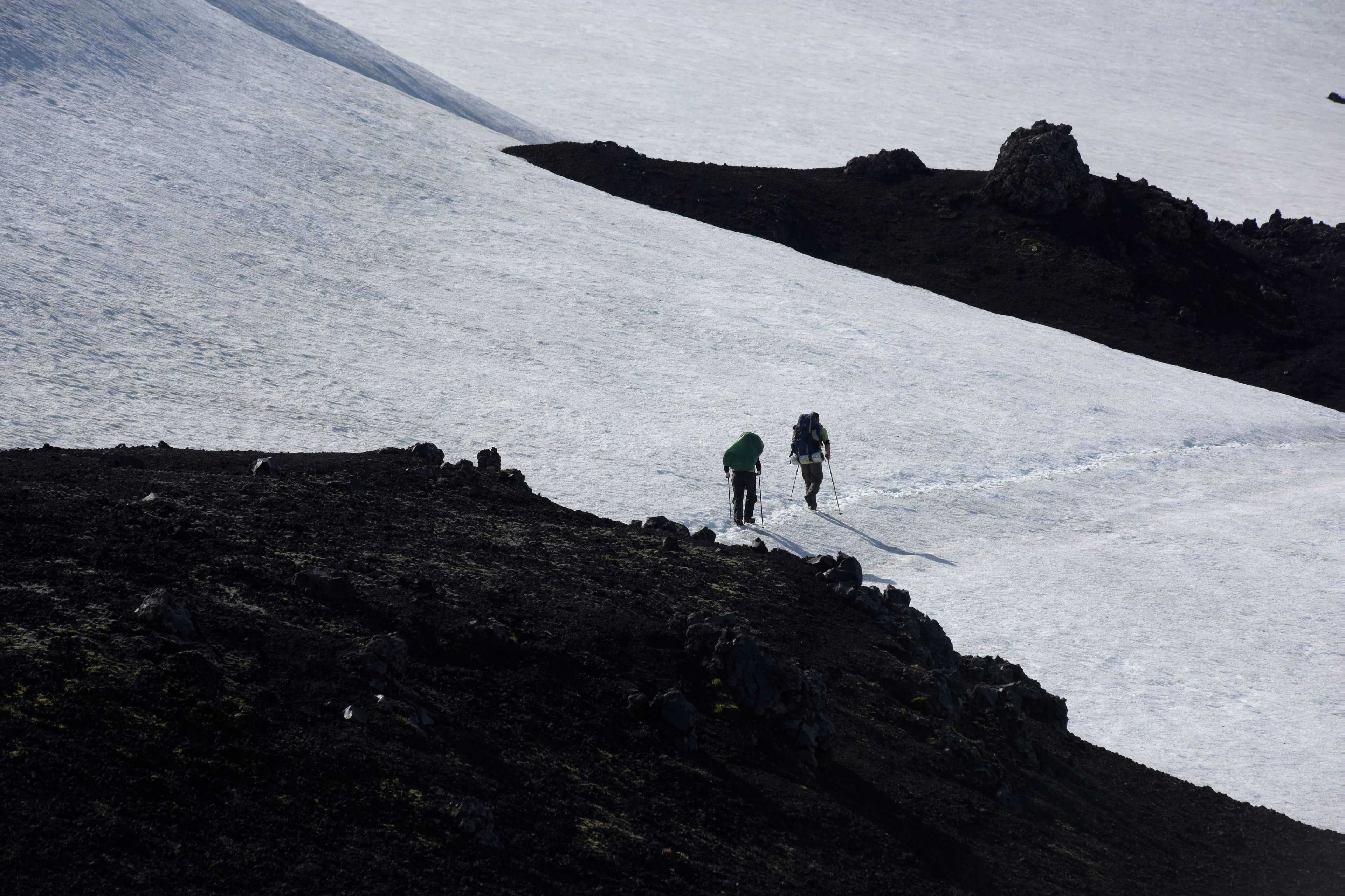 Two people climbing Hekla Volcano