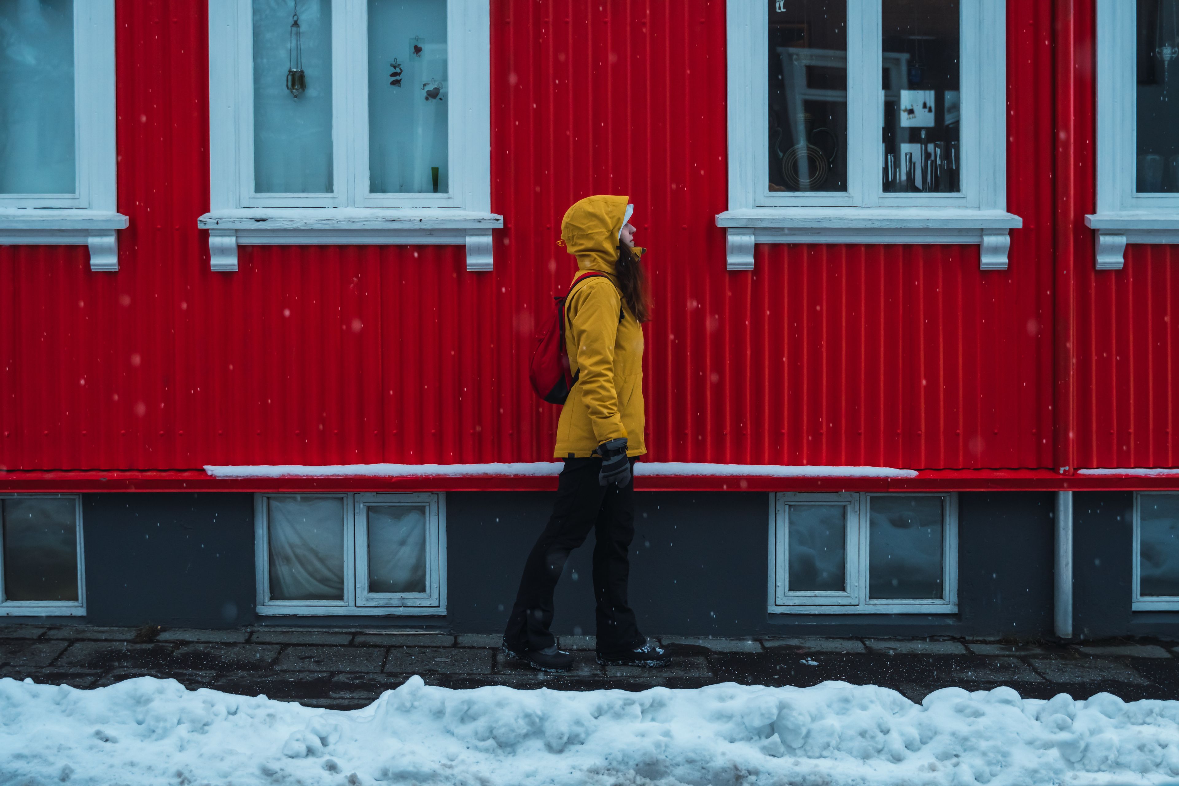 A picture of a person waring winter proof clothes in iceland