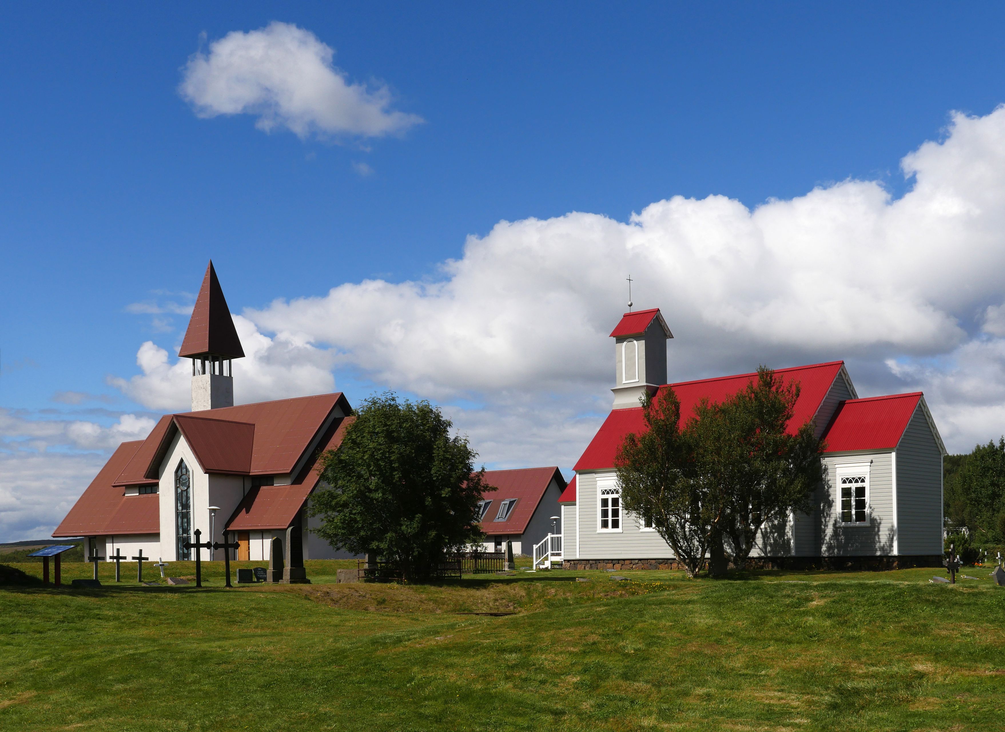 two white houses with red roof in West Iceland