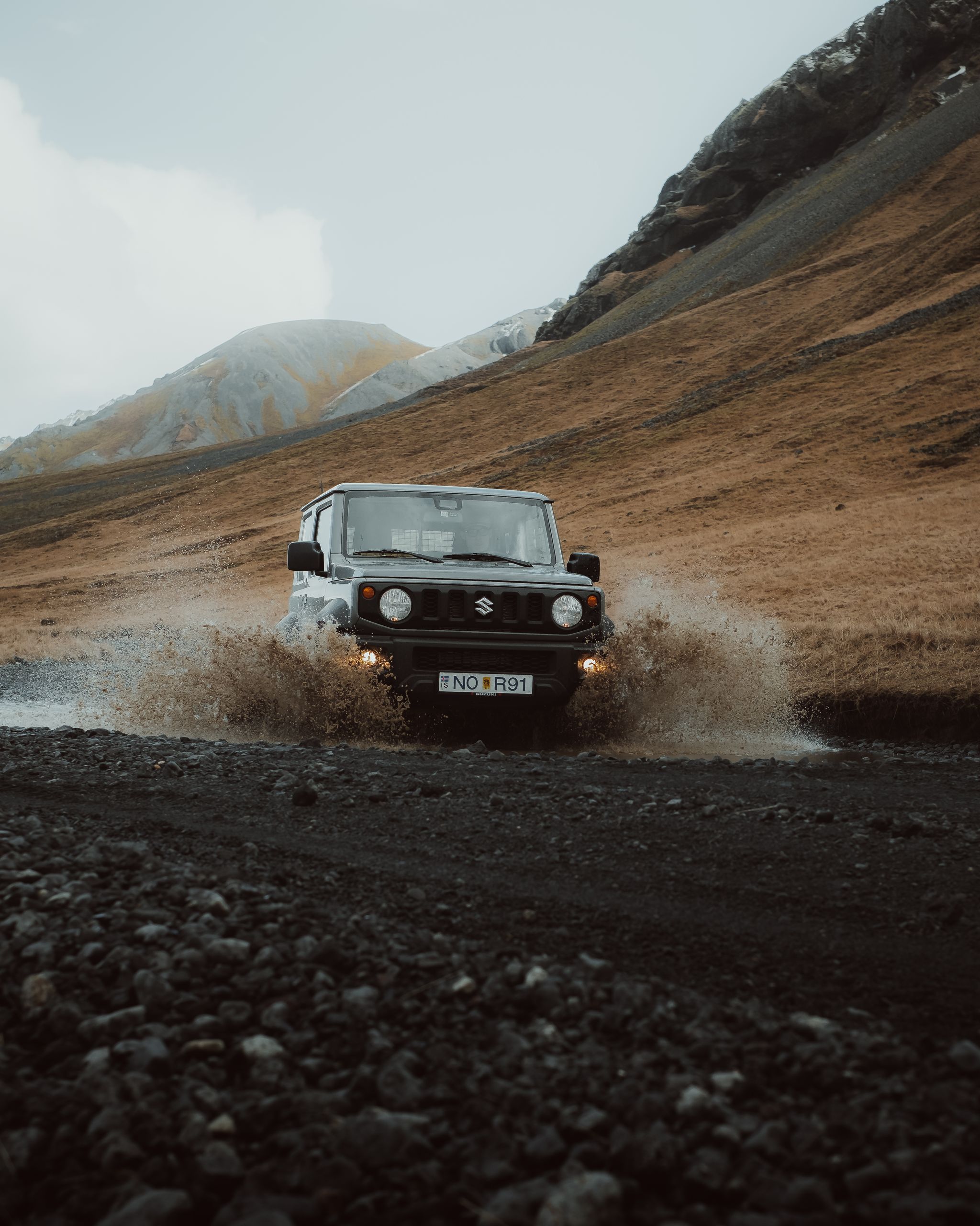 Suzuki Jimny crossing a river in Iceland