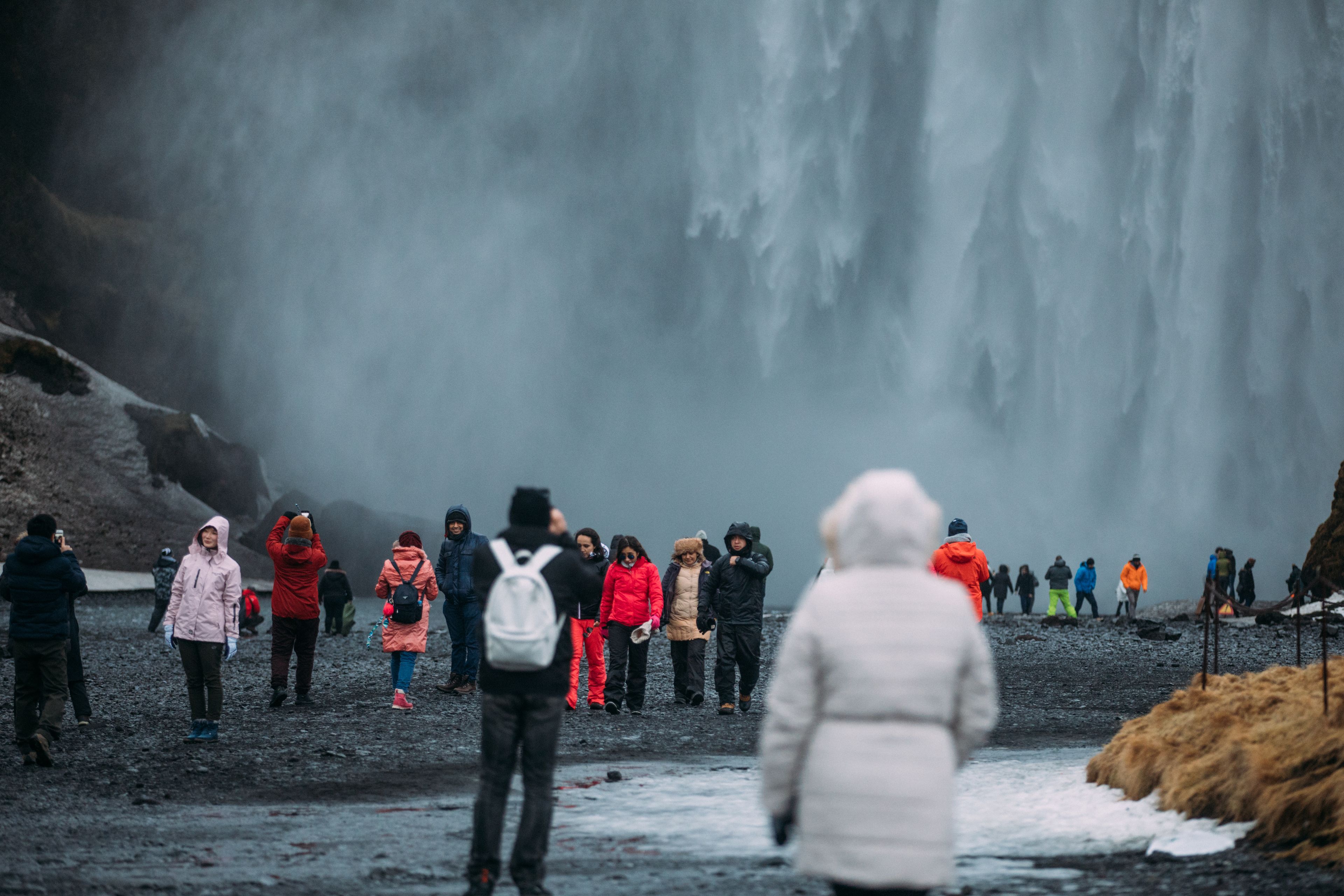 Tourists in Iceland wearing winter clothes