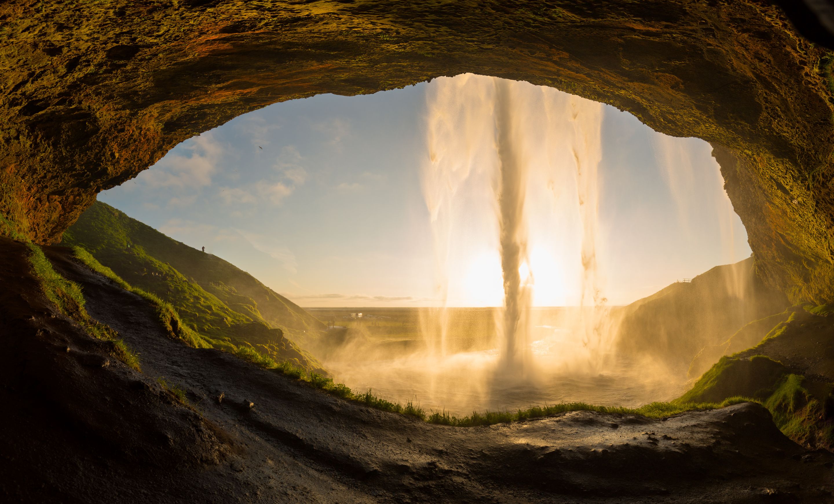 Seljalandsfoss seen from behind during the sunset