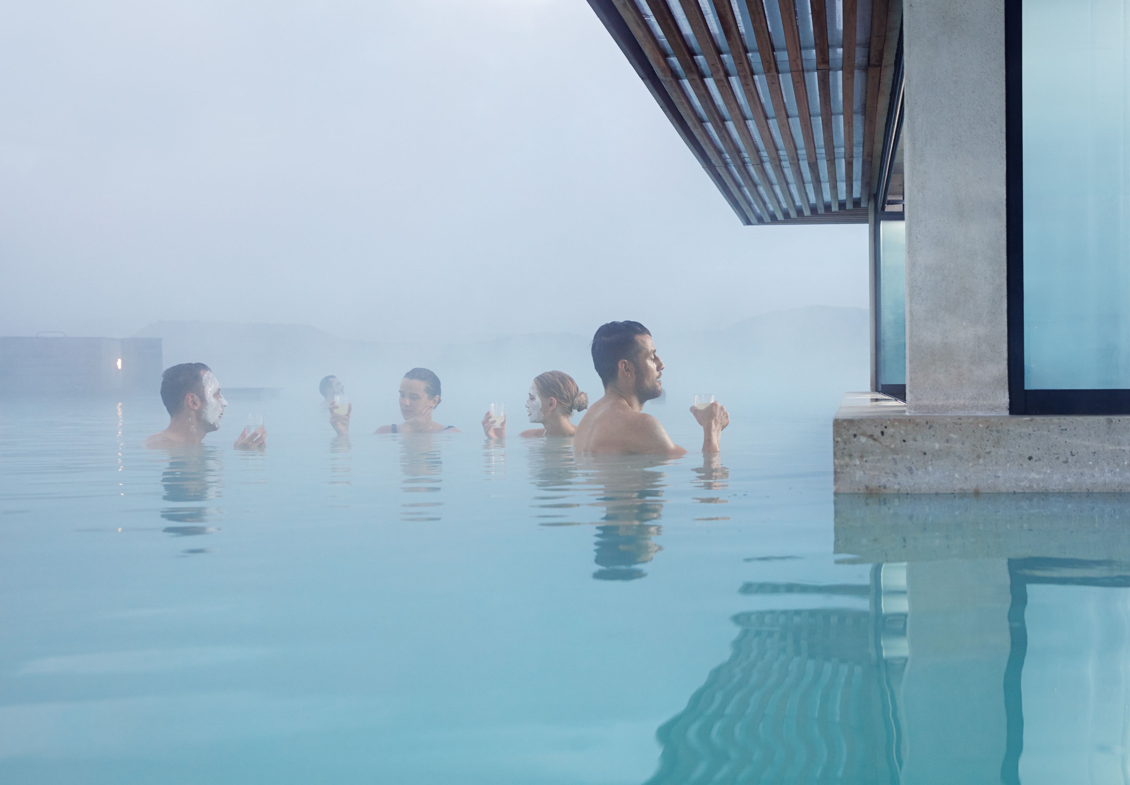 people visiting the in water mask bar in blue lagoon