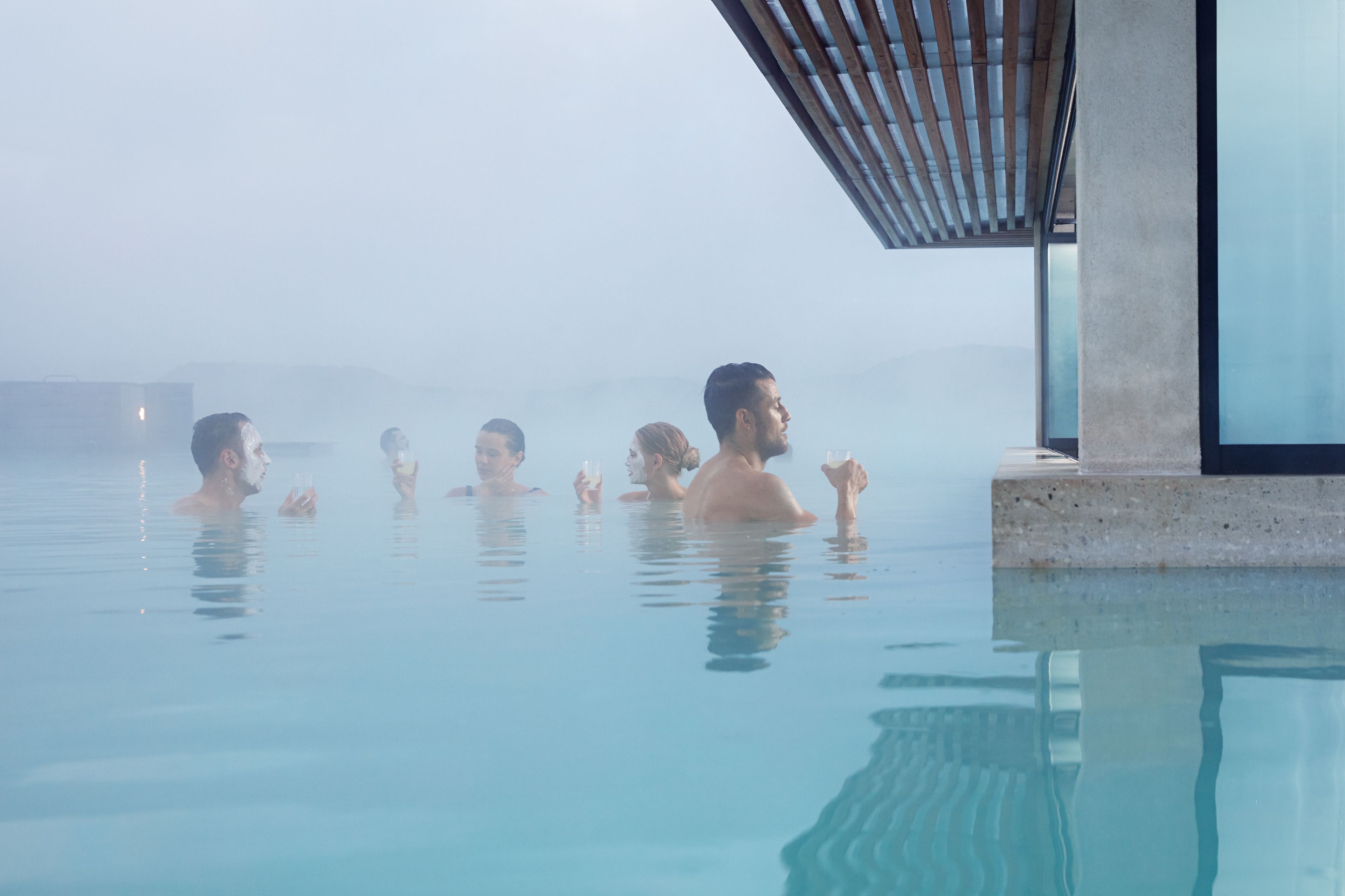 people visiting the in water mask bar in blue lagoon