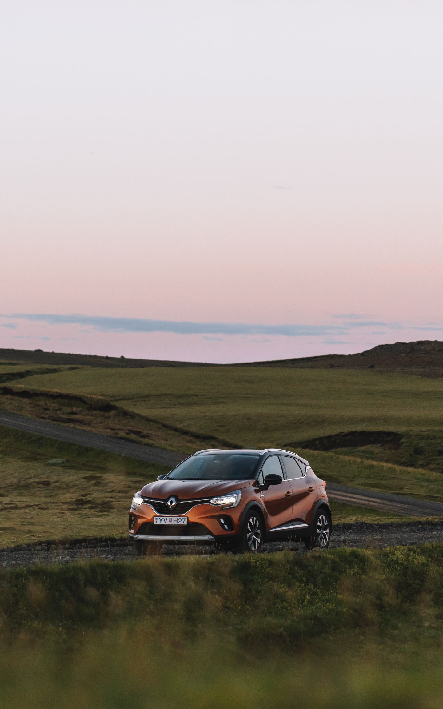 A midsize rental car from Go Car Rental effortlessly cruising through the magnificent landscapes of Iceland