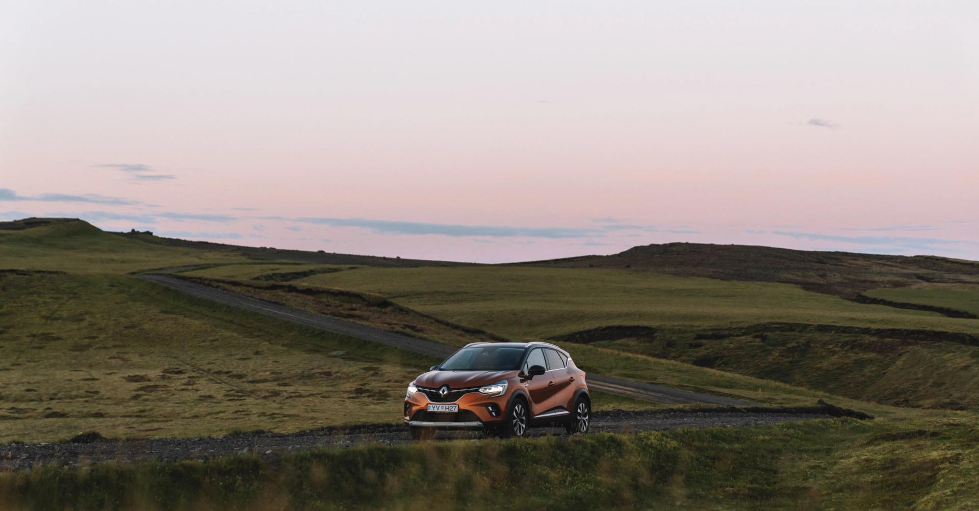 Rental car with a beautiful Icelandic landscape in the background